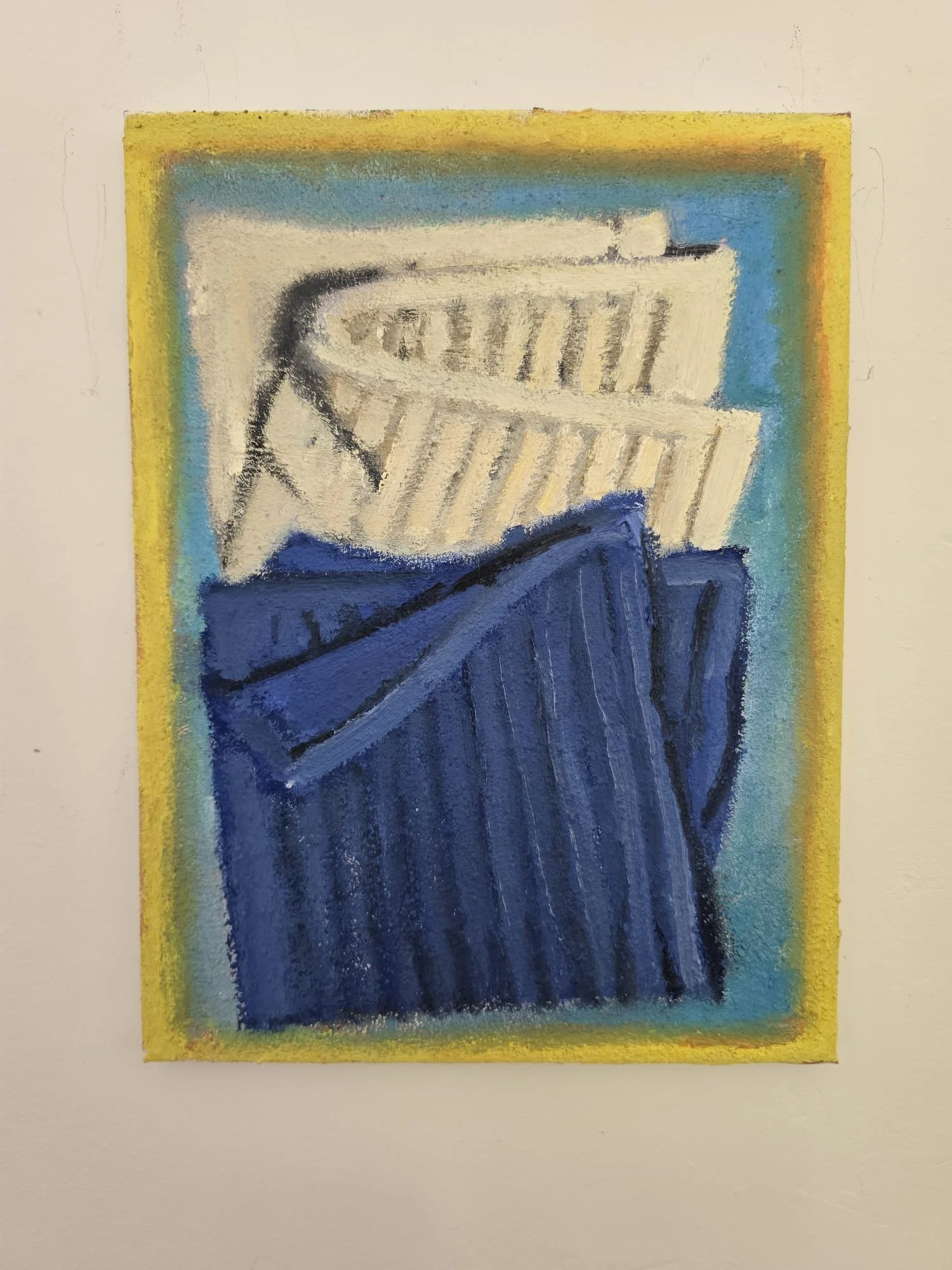A framed painting of a white dishcloth and blue dishcloth on a green background.