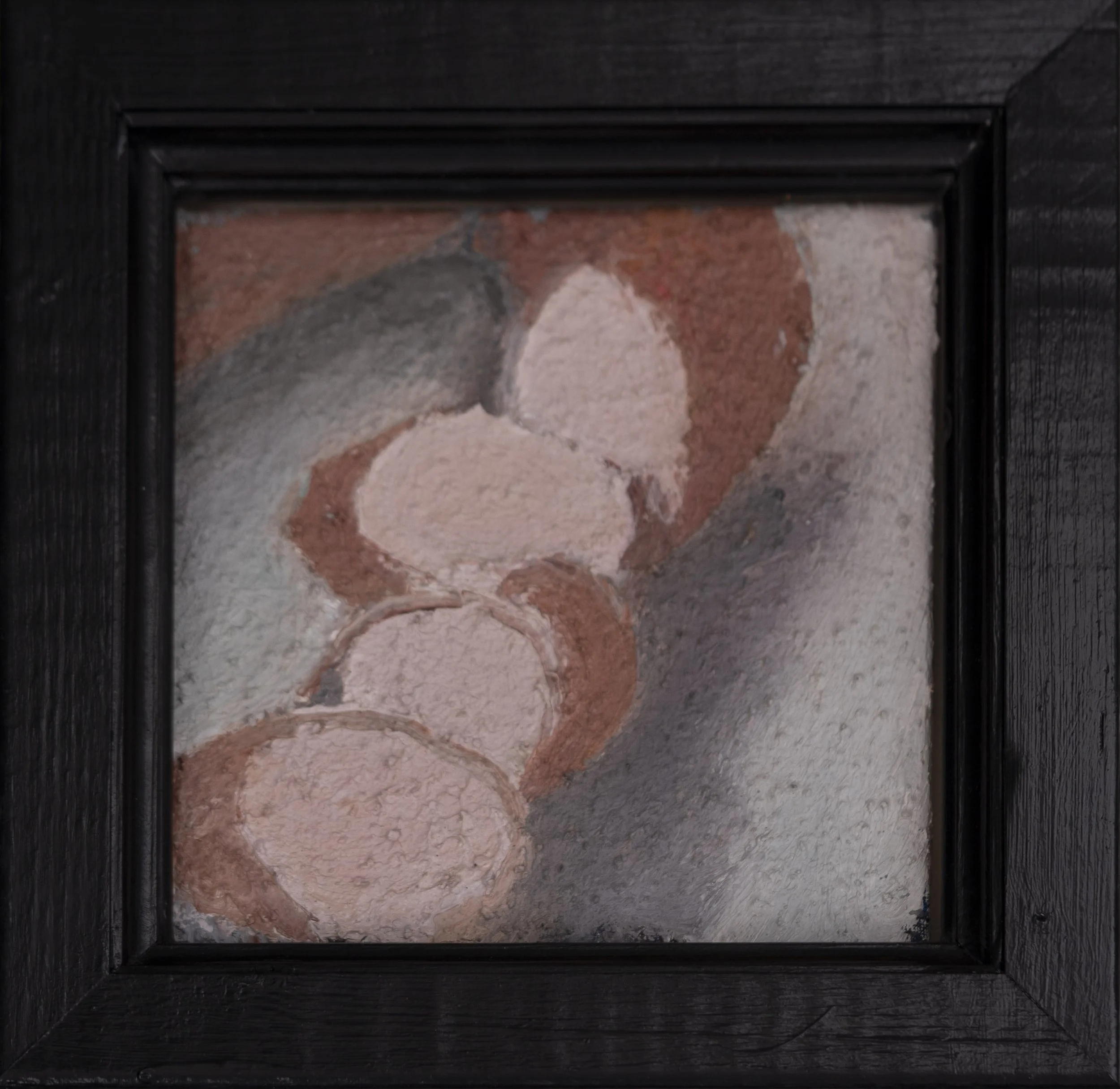 A framed painting of sausages.