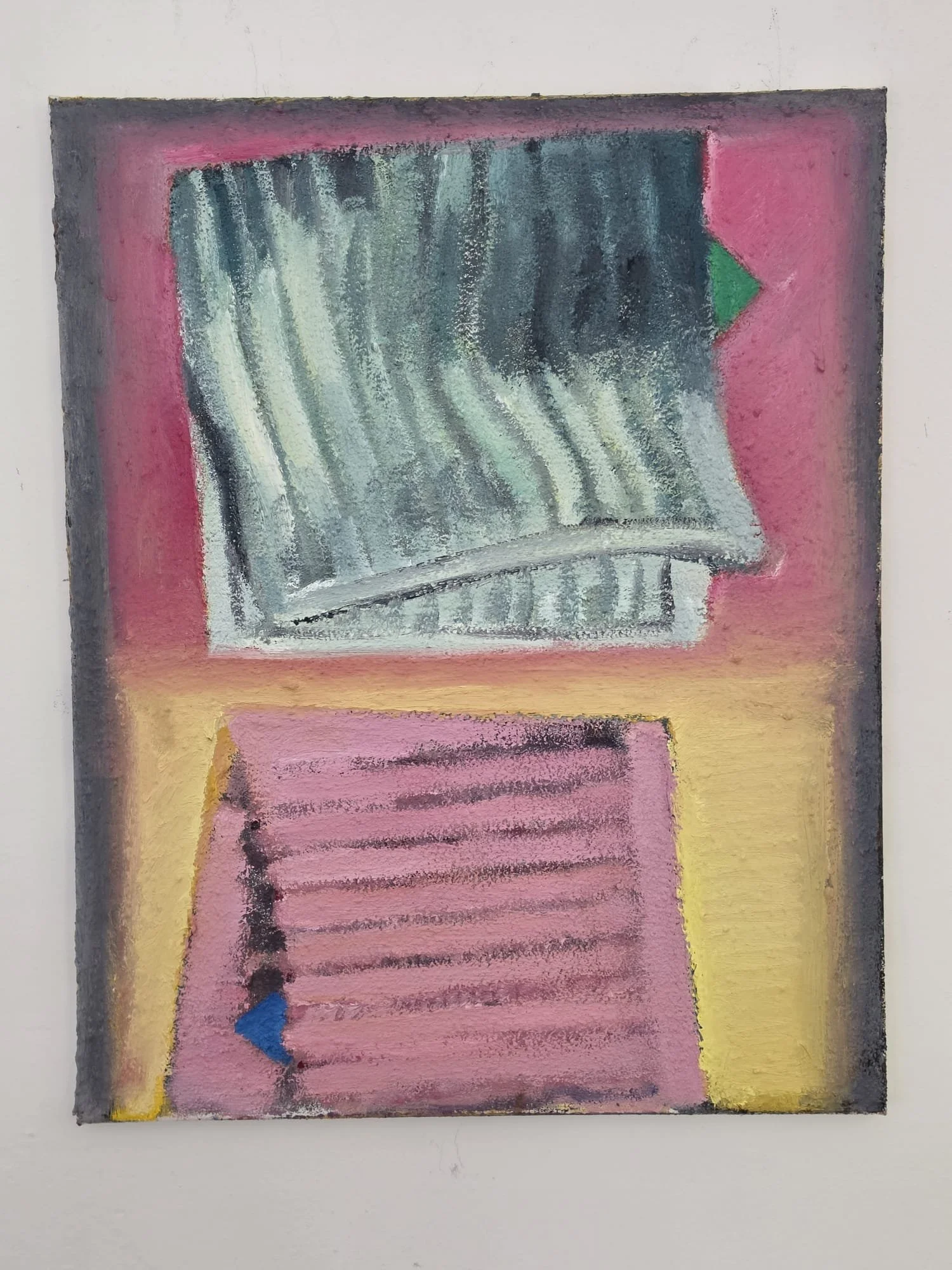 A framed painting of a black and grey dishcloth on a pink background and a pink dishcloth on a yellow background.