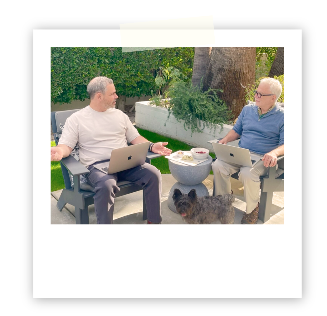 Polaroid picture of Scott Simon and Gregory Stock talking.