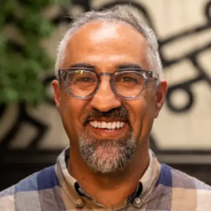 Portrait of Kia Afcari, Director, Greater Good Workplaces, Greater Good Science Center