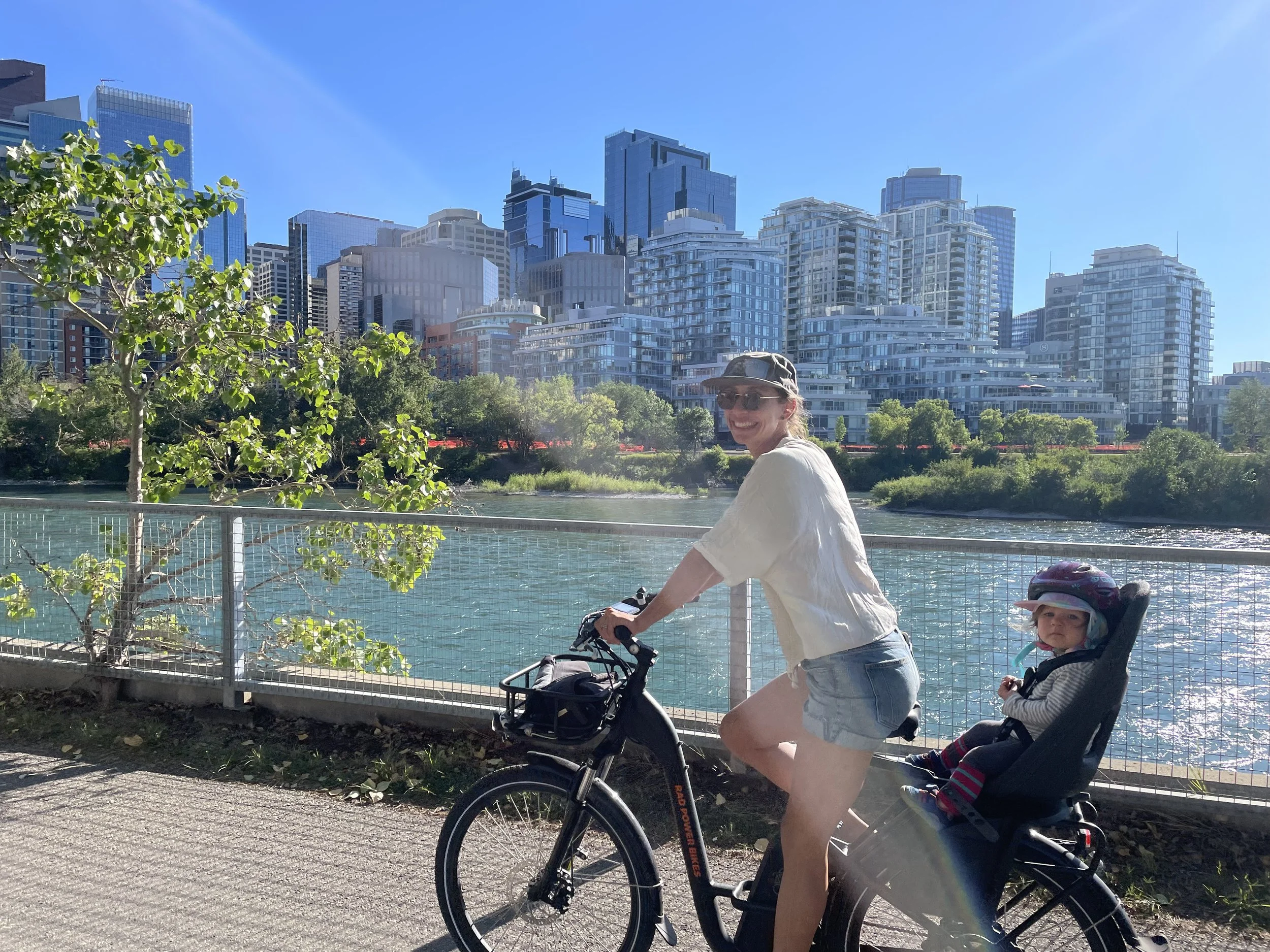 Image of Jenna Stoner and her daughter riding in the sunshine