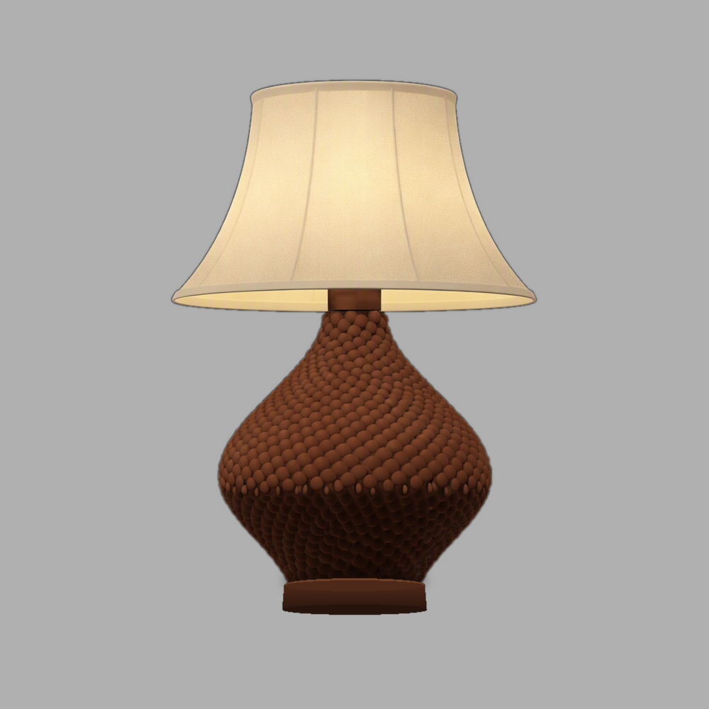 A table lamp whose base is a beaded spindle form