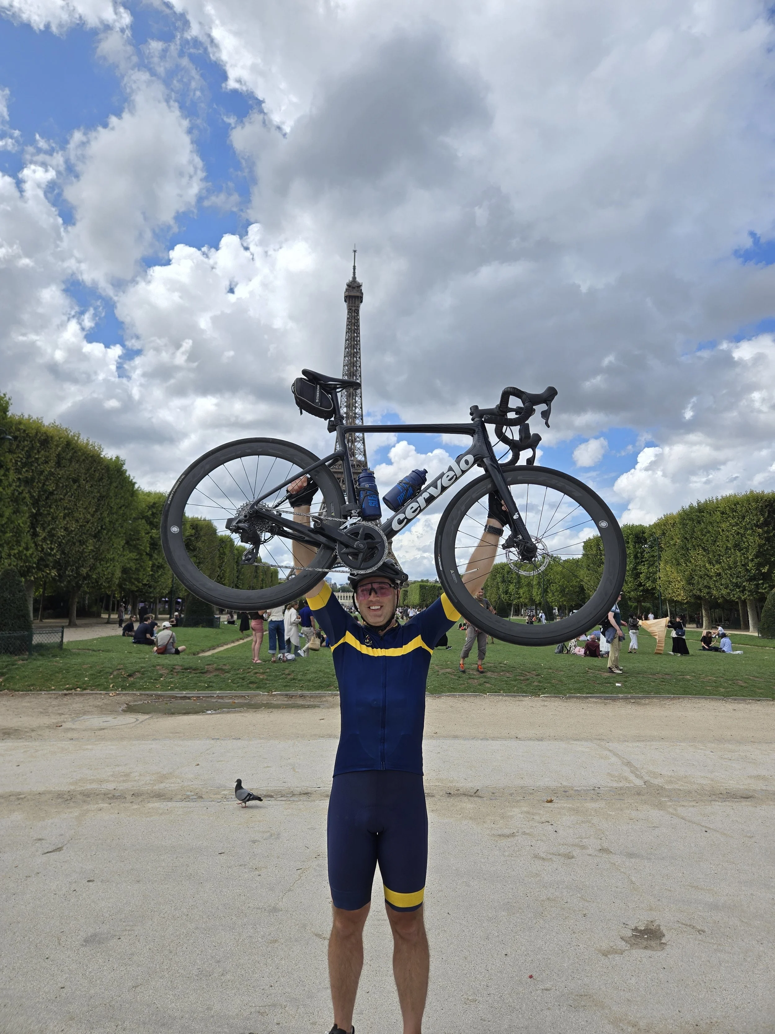 Matt at the end of cycling 21 stages of the Tour de France. Appleton Travel can bring your dream trip to life