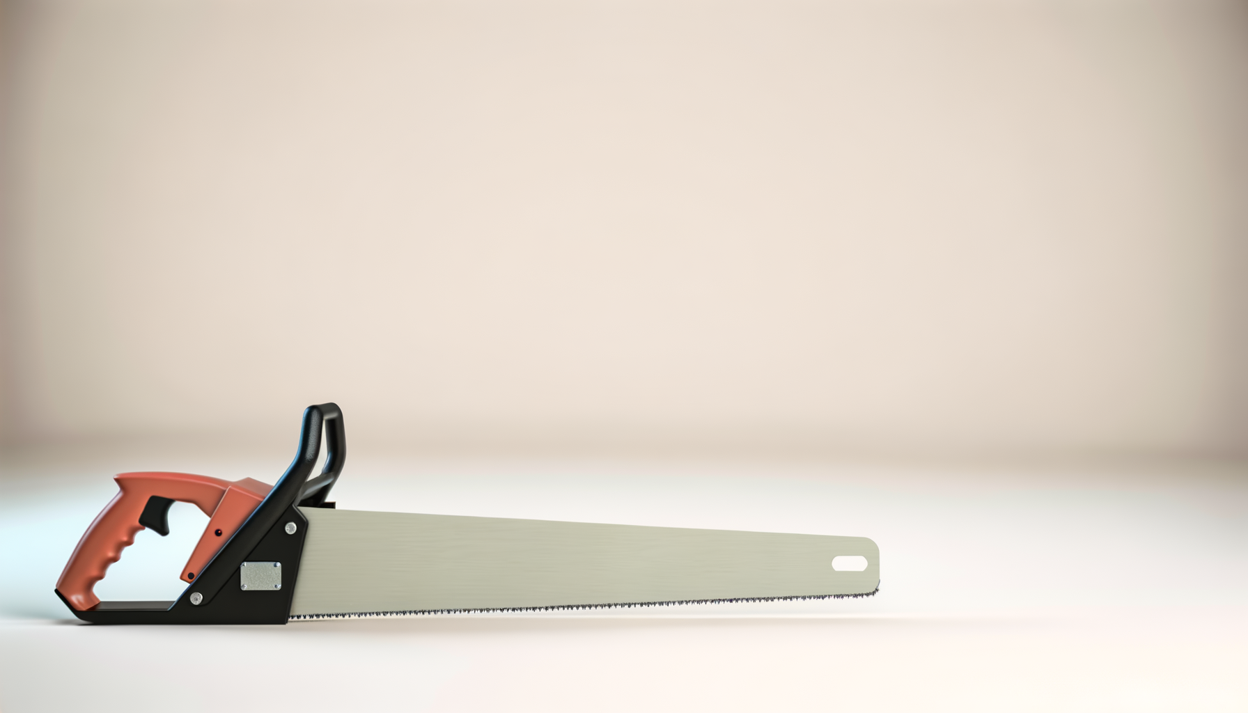 A close-up of a hand saw with an orange handle and a silver blade resting on a white surface, with a blurred plain background.