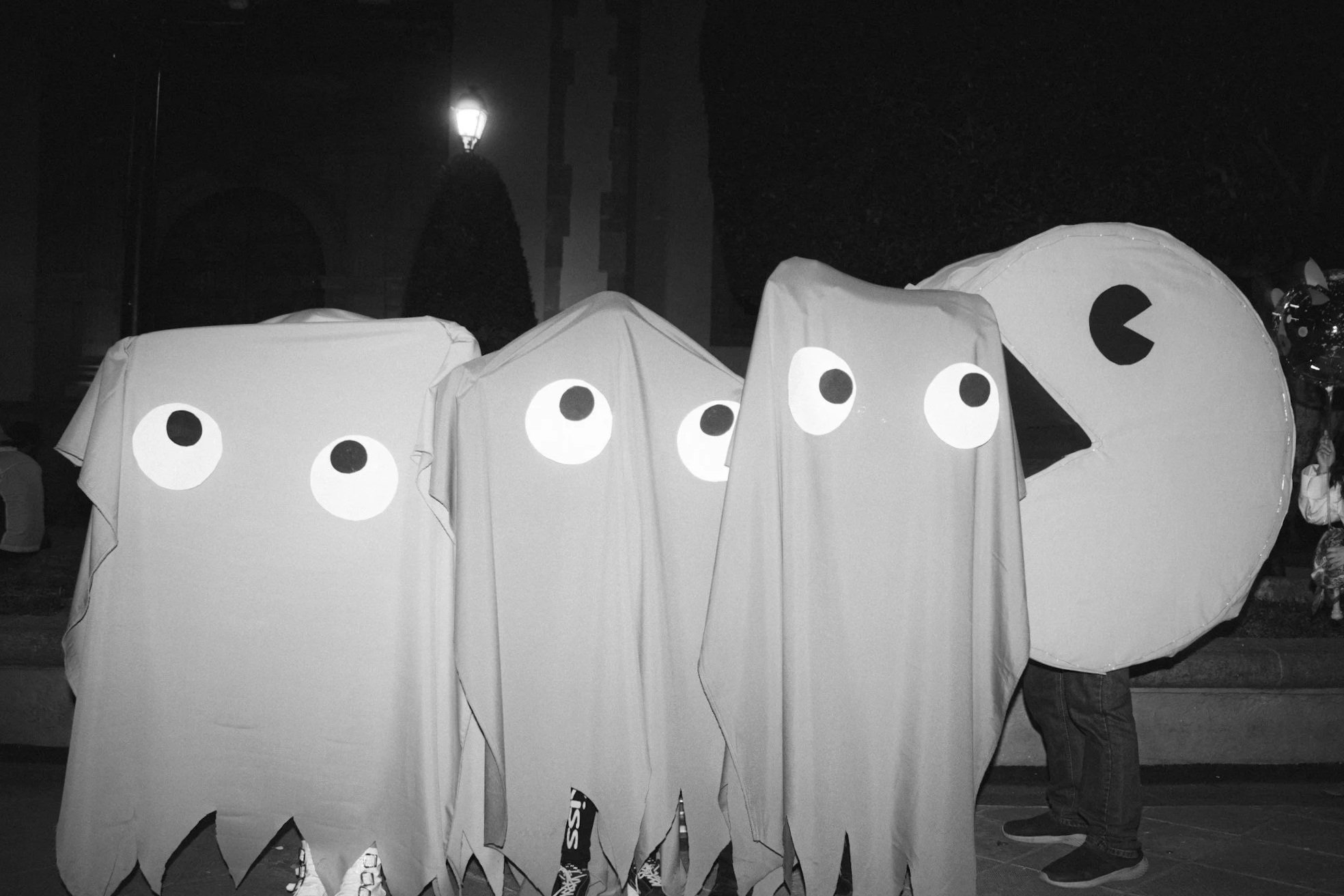 Group wearing homemade Pac-Man ghost and Pac-Man Halloween costumes