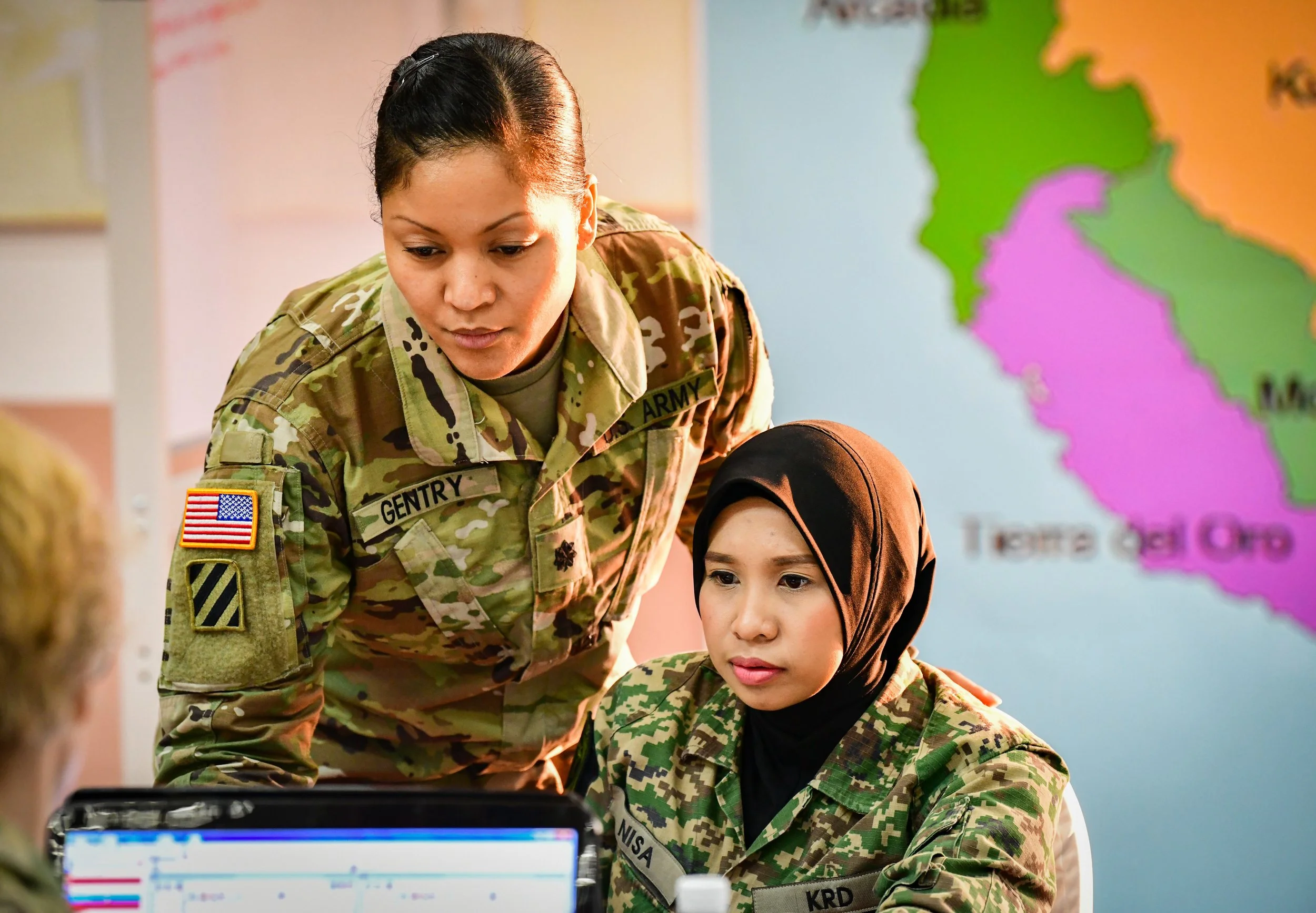 U.S. Army Lt. Col. Angela Gentry, Washington Army National Guard, discusses battle drills with her Malaysian army counterpart, Maj. Nurkhairunisa, during Exercise Bersama Warrior in Malaysia, March 10, 2019. Bersama Warrior is a joint bilateral exerc