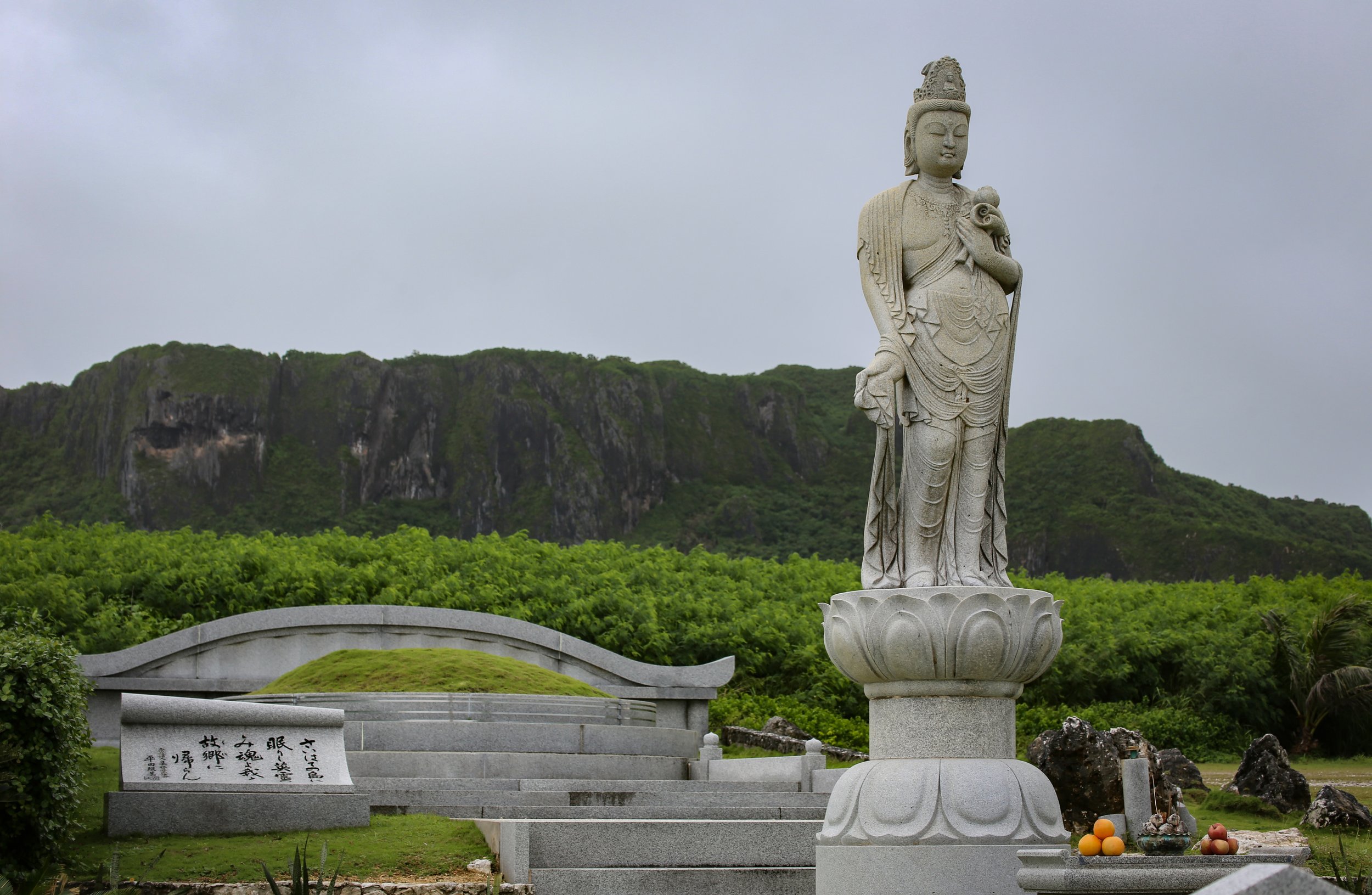 A memorial sits at the base of Suicide Cliff on the island of Saipan. The cliff was the site where thousands of Japanese soldiers and civilians jumped to their deaths in order to avoid capture by American soldiers during WWII