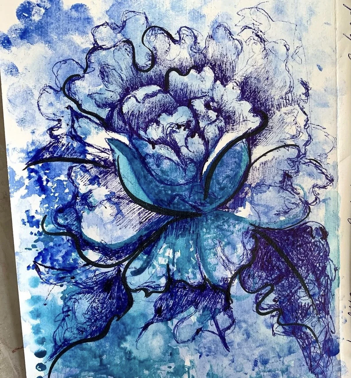Blue watercolor painting of a flower
