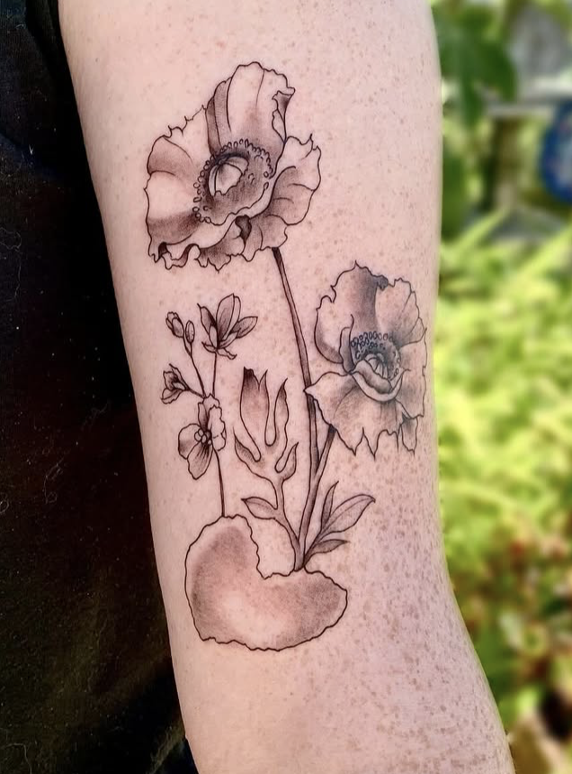 Poppy and wildflower tattoo on the forearm