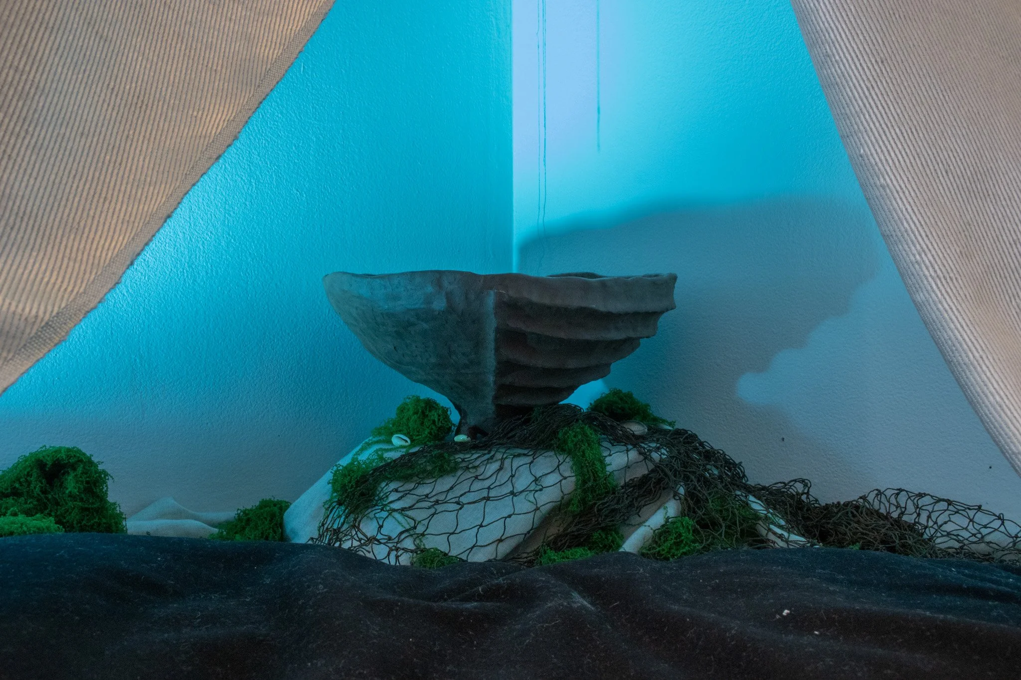 "give your body, give your blood", ceramic, fabric, fishing netting, cowrie shells, fake moss, jewelry, 2026