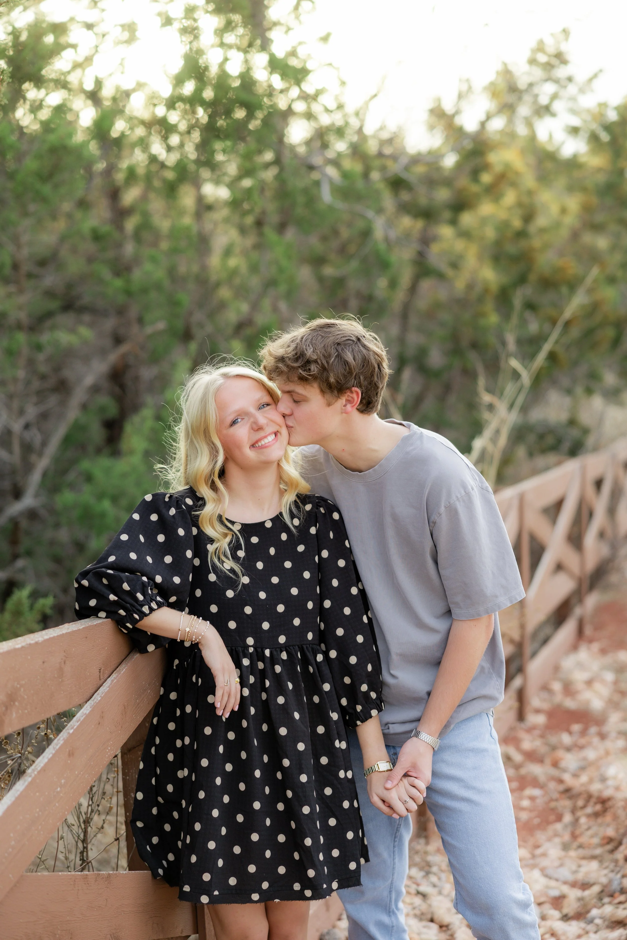 Couple sharing a kiss during an outdoor couples photography session.