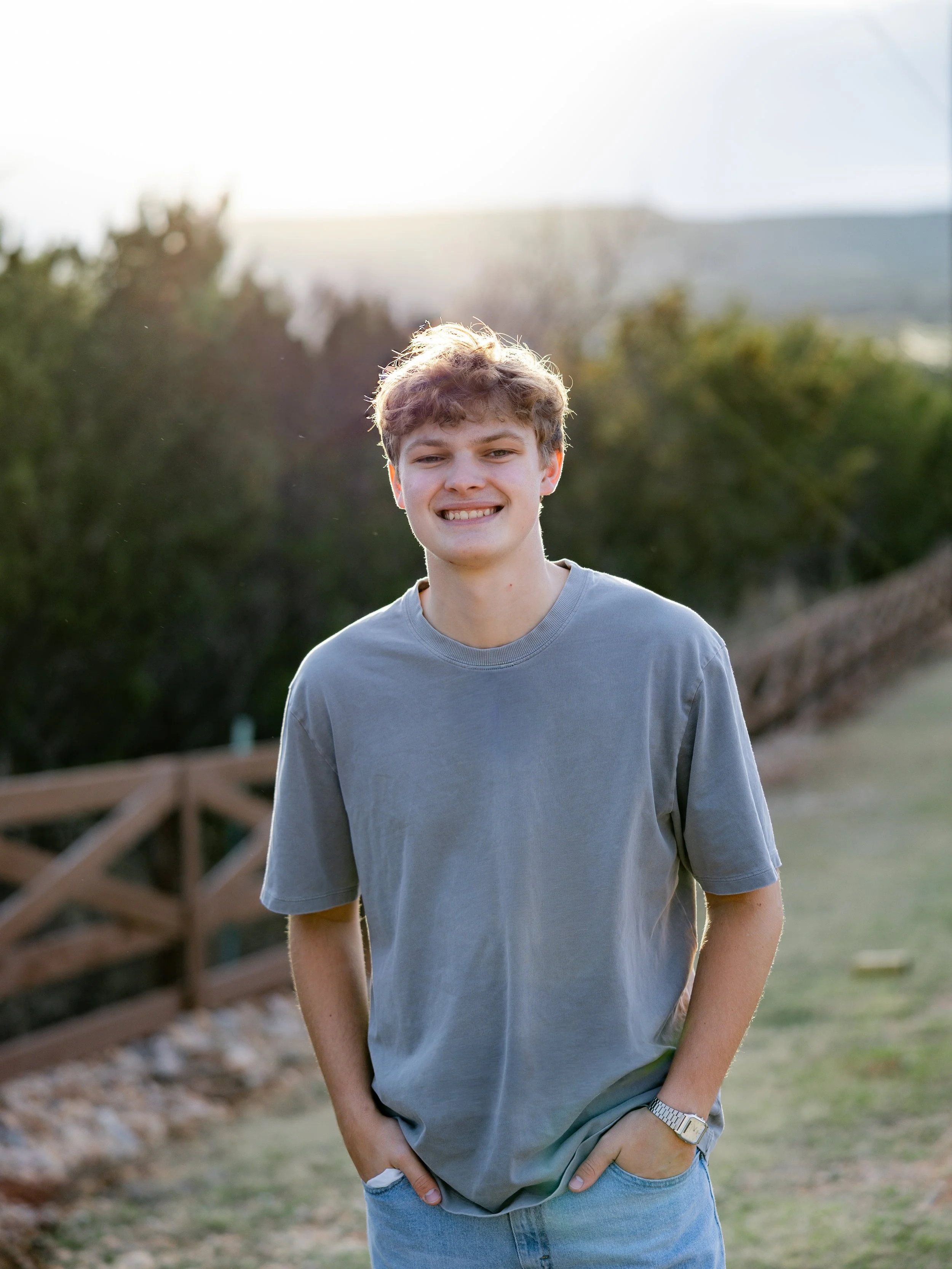Young man posing outdoors during a casual portrait photography session.