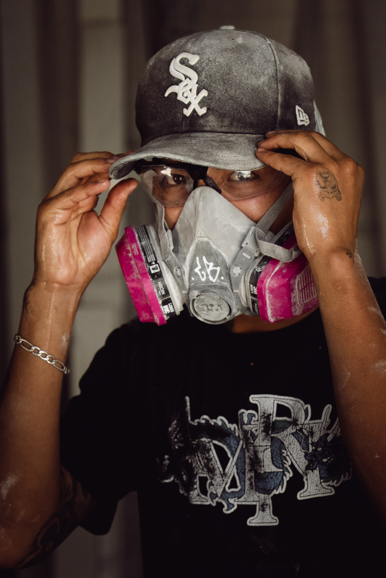 A stonemason's apprentice dons his PPE.