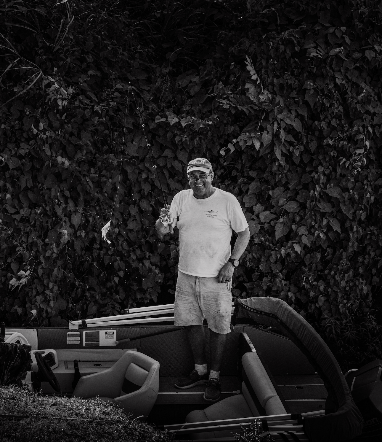 A fisherman happy with his catch in small town Arkansas. See our story 'A boy and his Dad'.