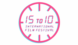 Pink clock face with digital text reading '15 to 10 International Film Festival' in the center