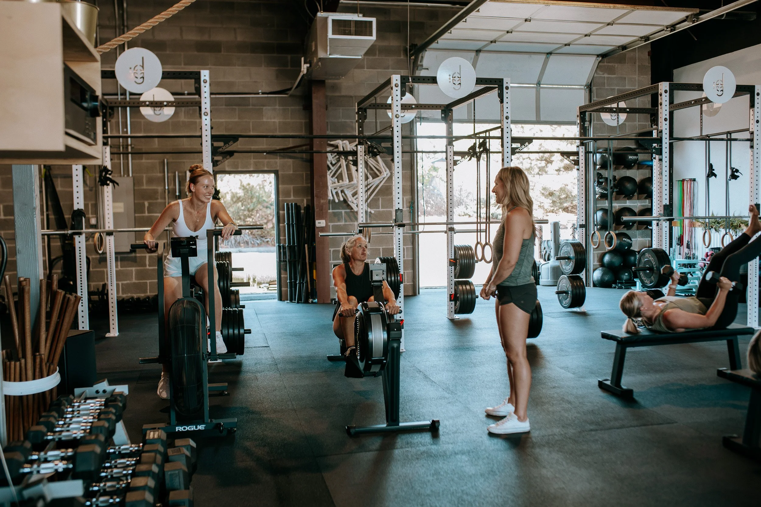 Two members of Dropgym work with coach Shantell.