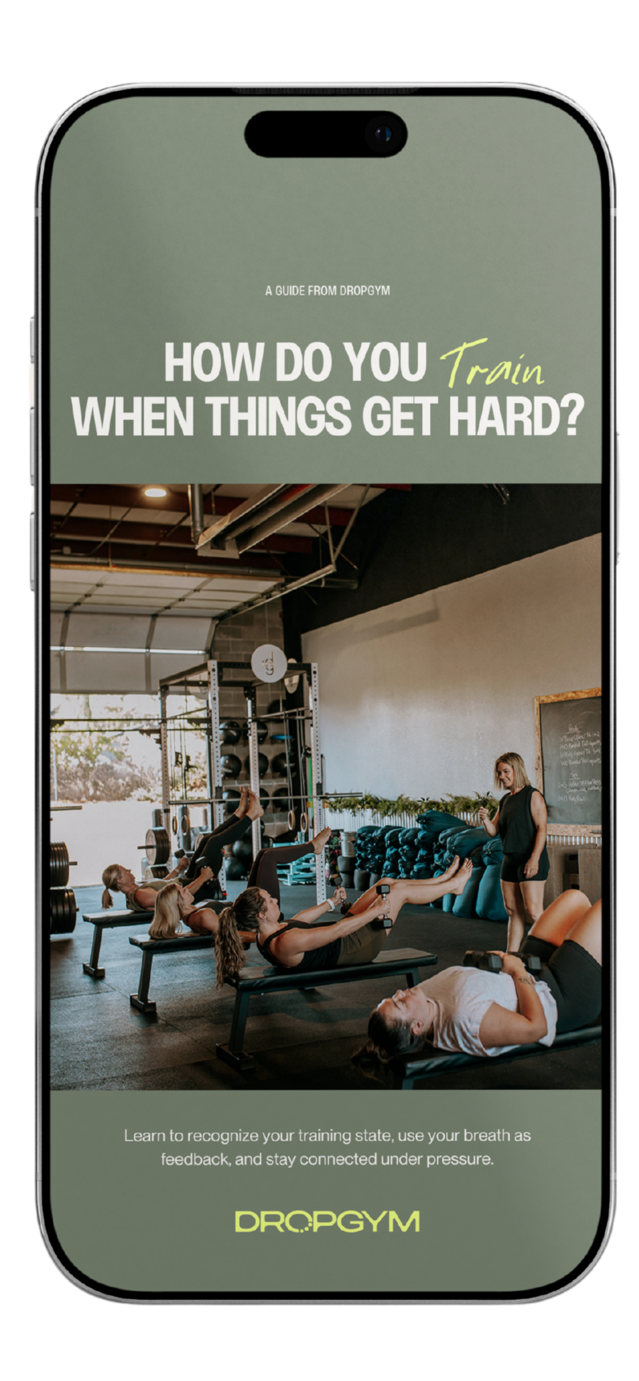 Smartphone screen displaying a fitness guide titled 'How Do You Train When Things Get Hard?' with an image of women exercising on benches in a gym, and a trainer assisting them, along with text about recognizing training state and using breath as feedback.