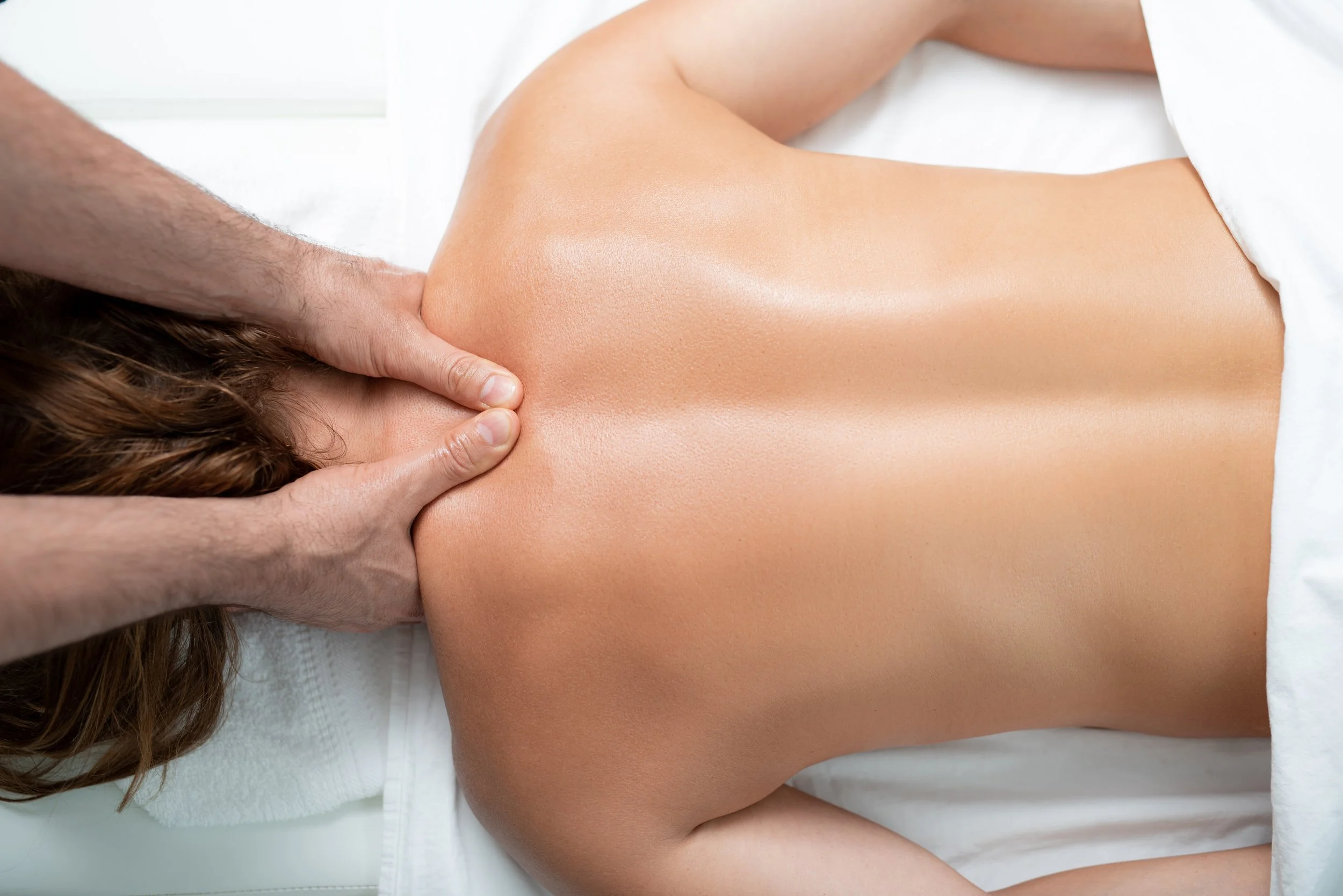 Person receiving a massage on their back.