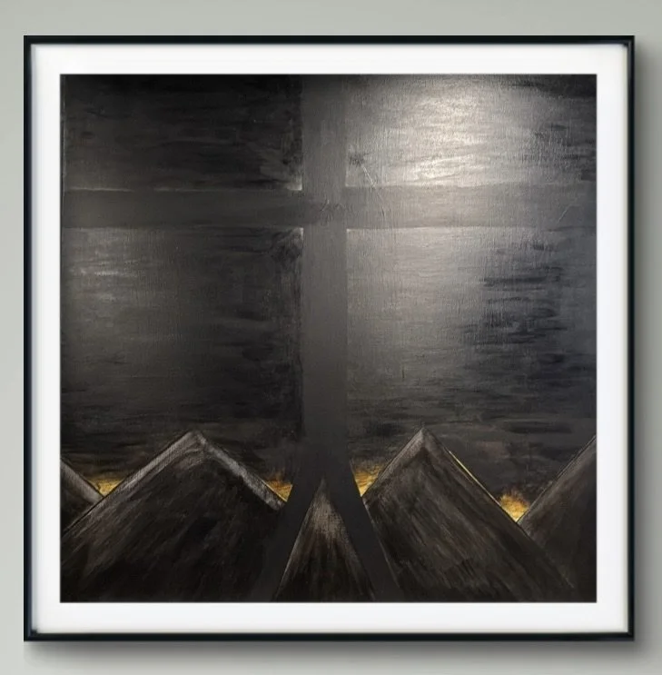 Abstract painting of dark mountains and sky with a cross in the sky, framed in black with a white mat.