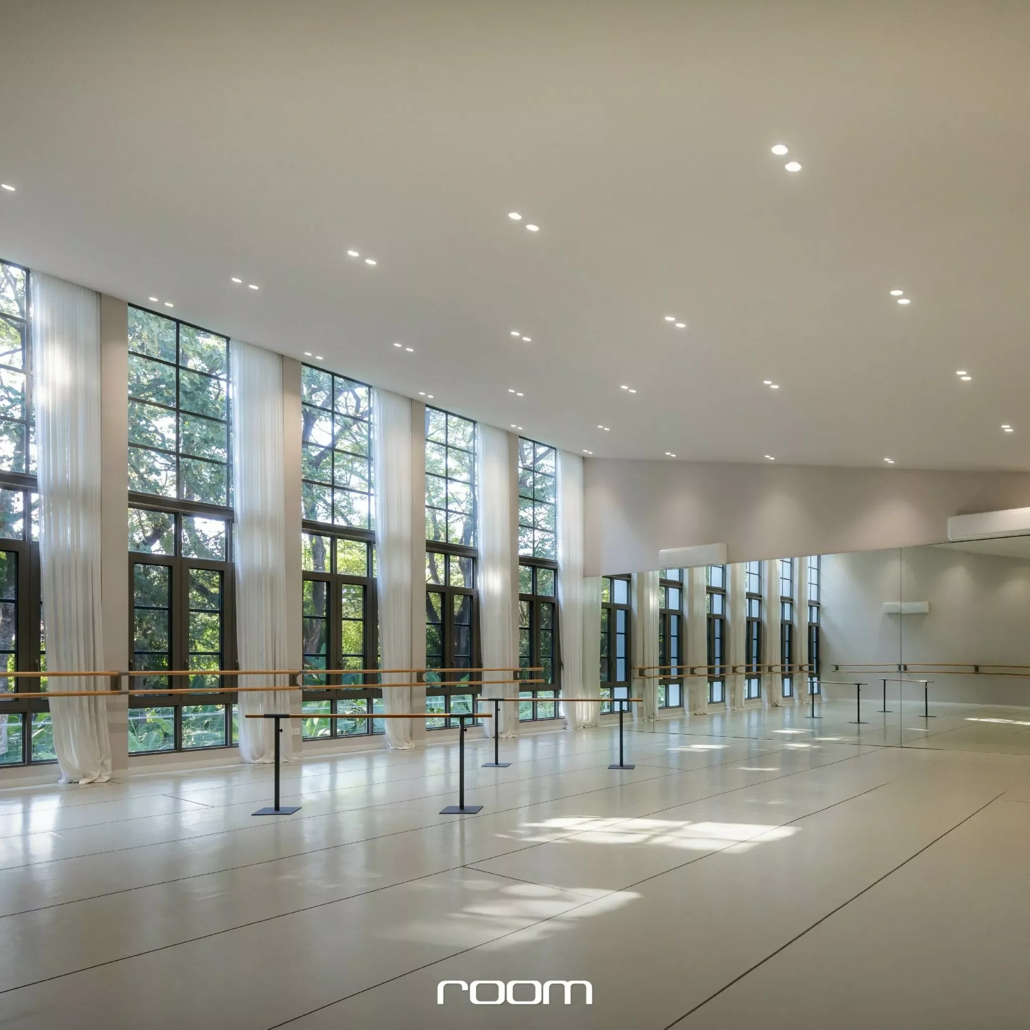 Interior of a modern dance studio or gymnasium with large windows and a high ceiling, incorporating rows of ceiling lights, ballet barres, and natural light streaming through sheer curtains.