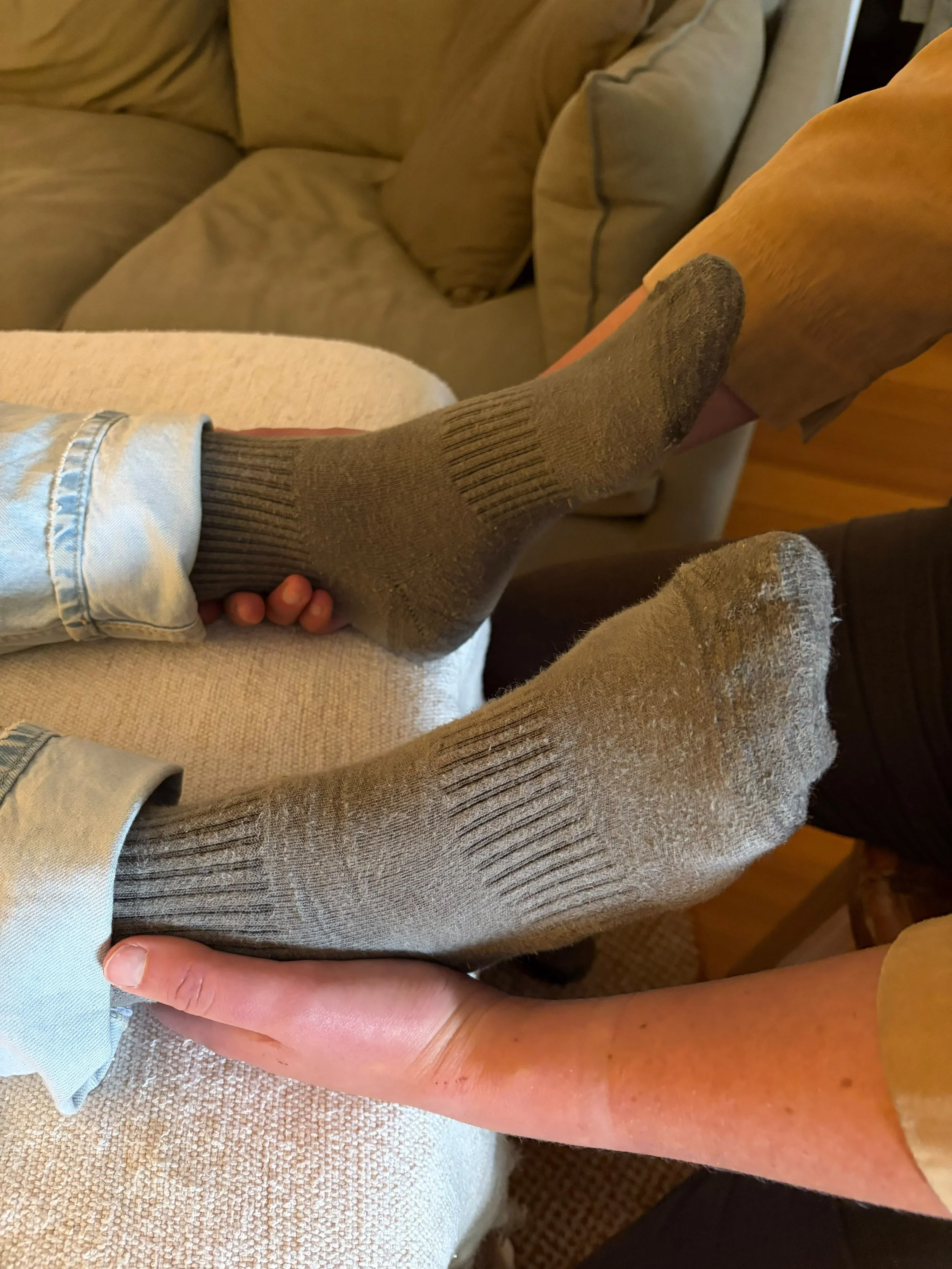 A person receiving biodynamic craniosacral therapy.