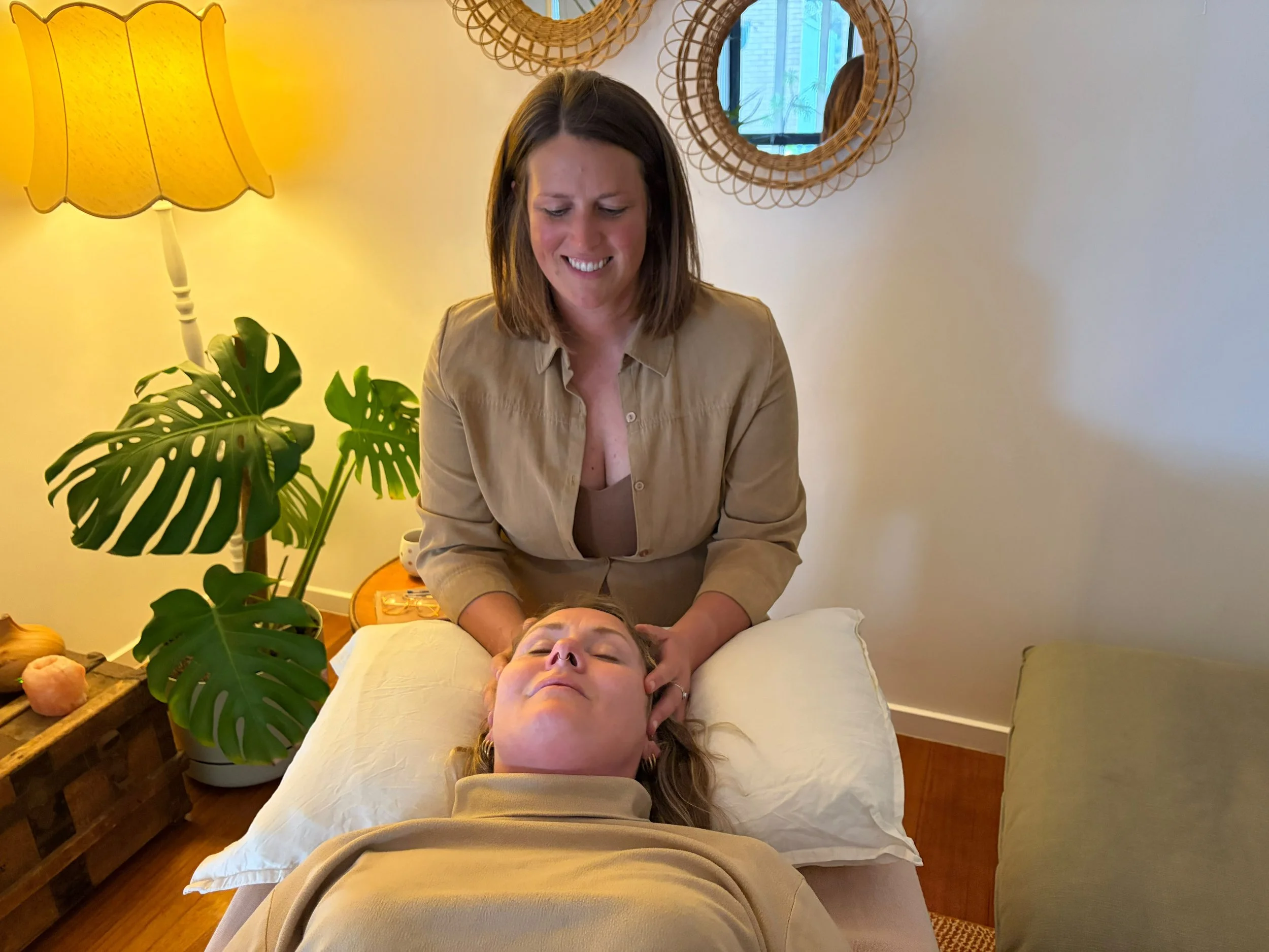 A person receiving biodynamic craniosacral therapy.