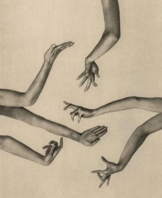 Drawing of five human arms and hands reaching and gesturing towards each other with fingers extended.