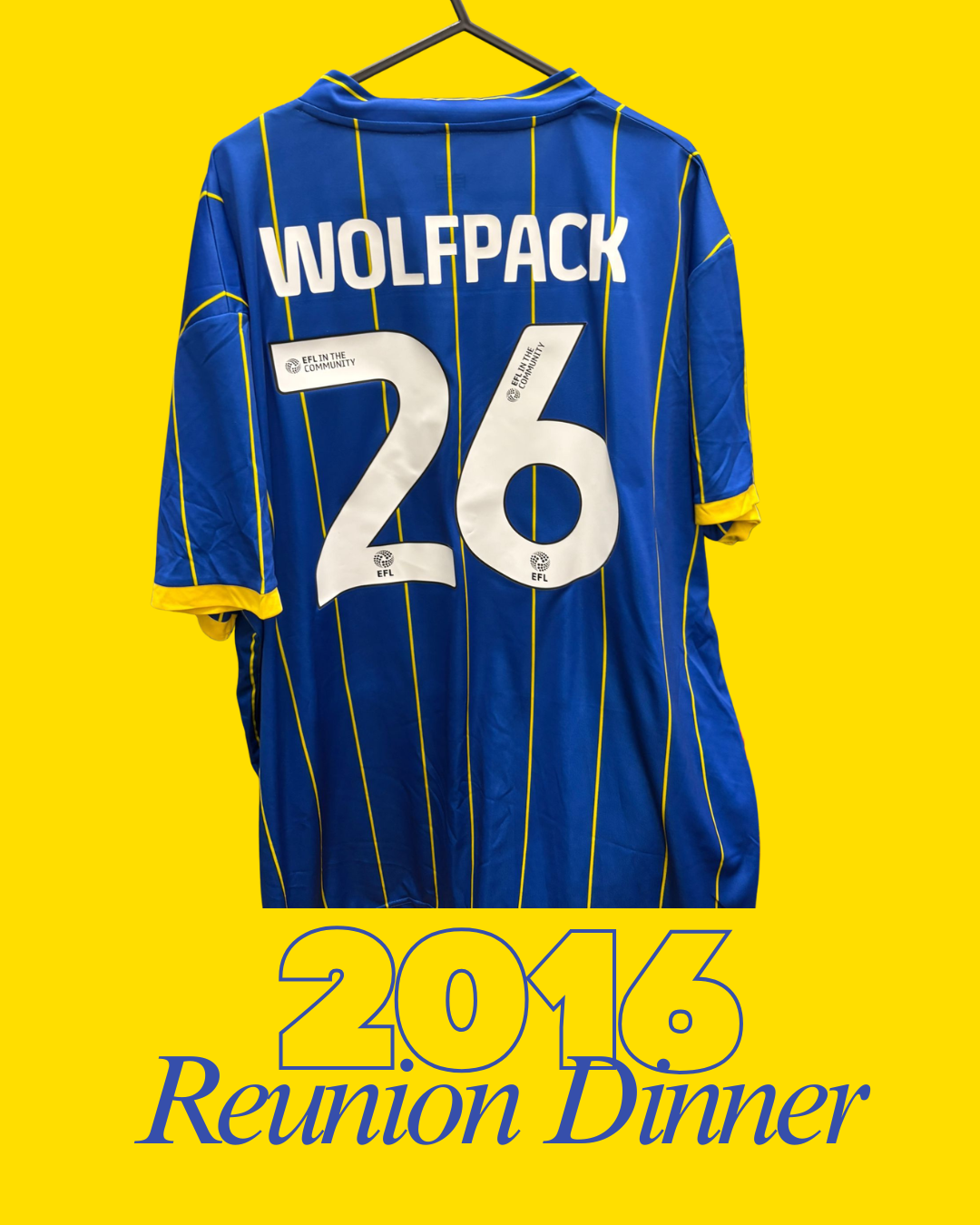 A blue AFC Wimbledon football shirt with yellow pinstripes hanging on a yellow background. The back of the jersey has the name "WOLFPACK" and the number "26" with the logo "EFL IN THE COMMUNITY." Below the jersey, text reads "2016 Reunion Dinner".