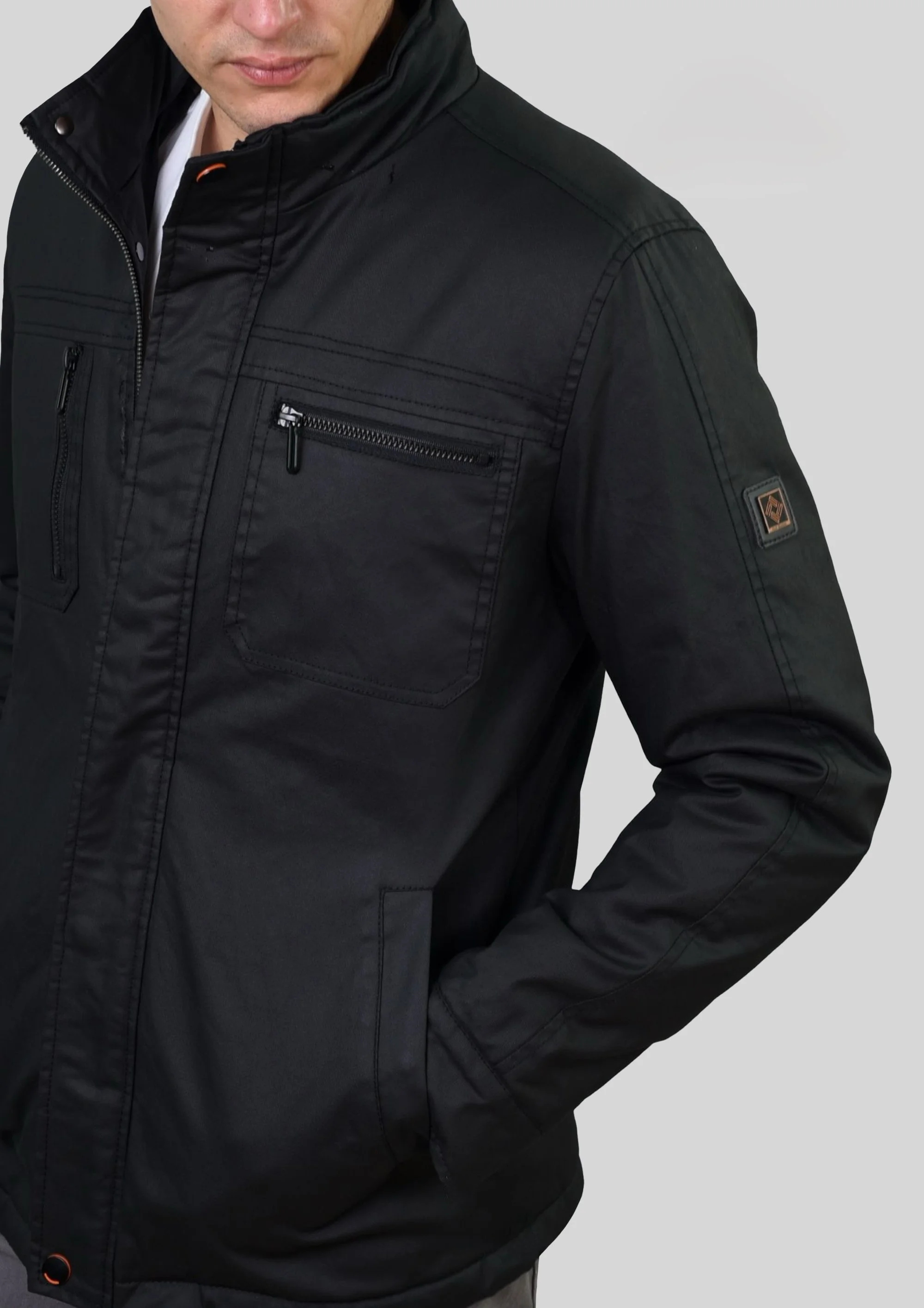 Parka multibolsillos negra de algodón diagonal encerado