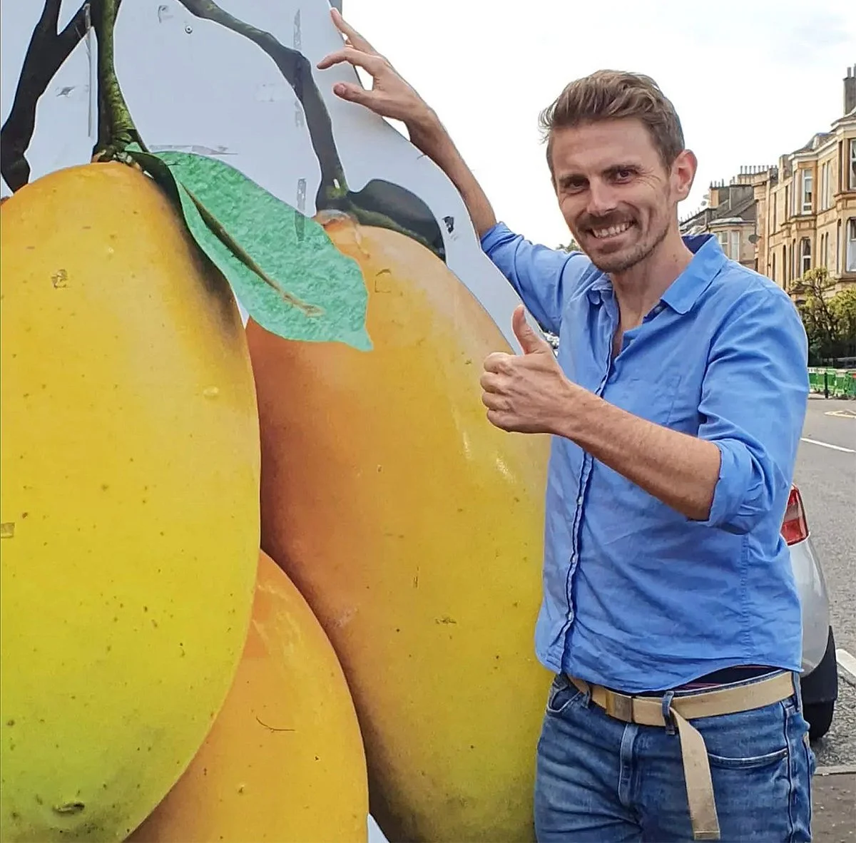 Kieron Redmond making friends with some giant manoges near his home in Pollokshields, Glasgow.