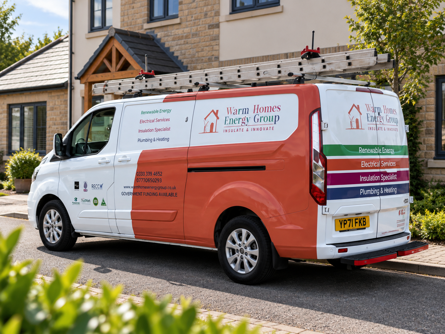 A white company van with colorful branding for Warm Homes Energy Group parked in front of a house. The van has text indicating services such as renewable energy, electrical services, insulation specialist, and plumbing & heating. It has a ladder mounted on top.