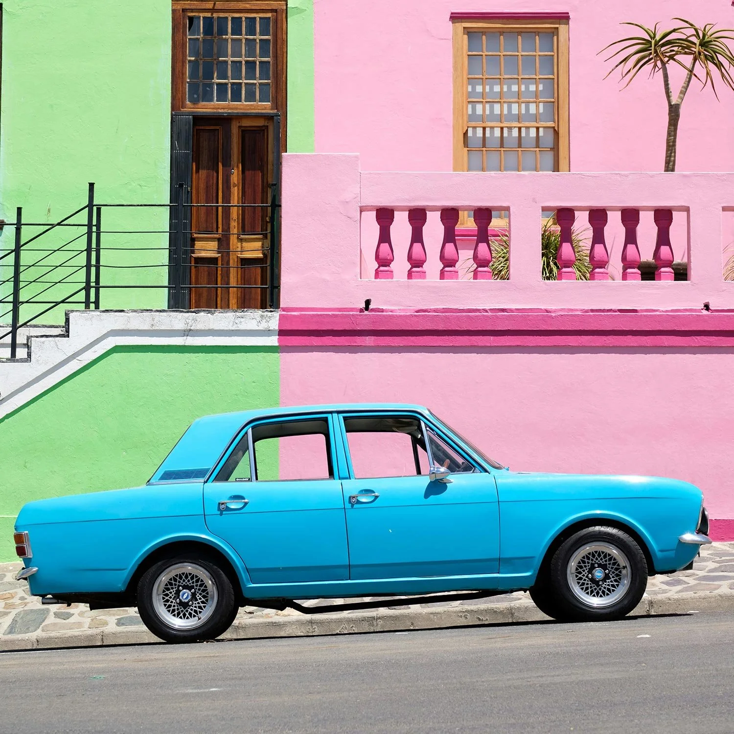 Why Origo. Blue car parked on a colourful street in Cape Town’s Bo-Kaap