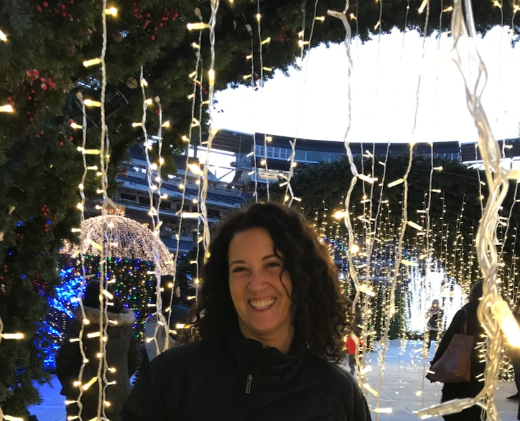 Helene Kiser beneath holiday lights