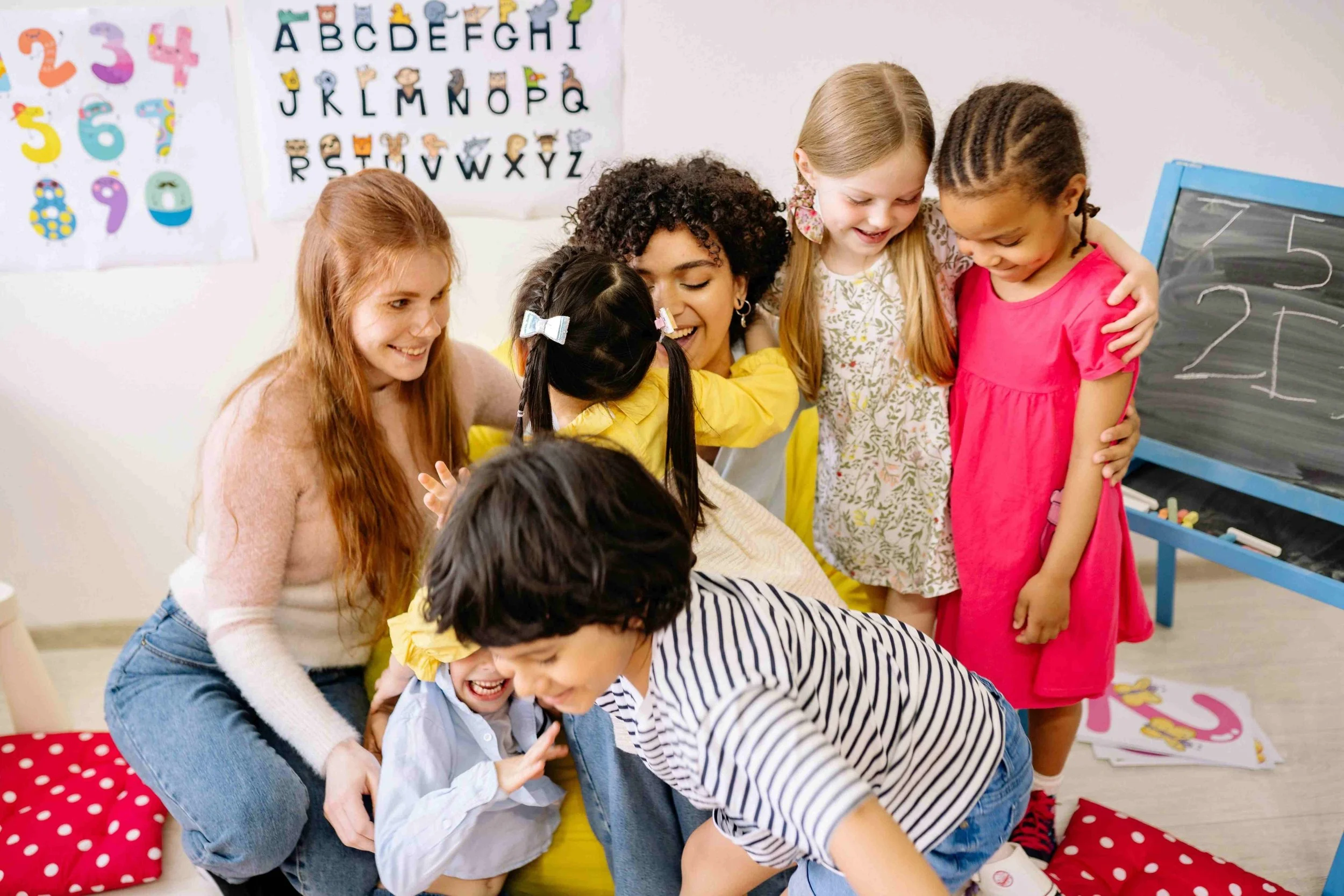 teachers and students hugging