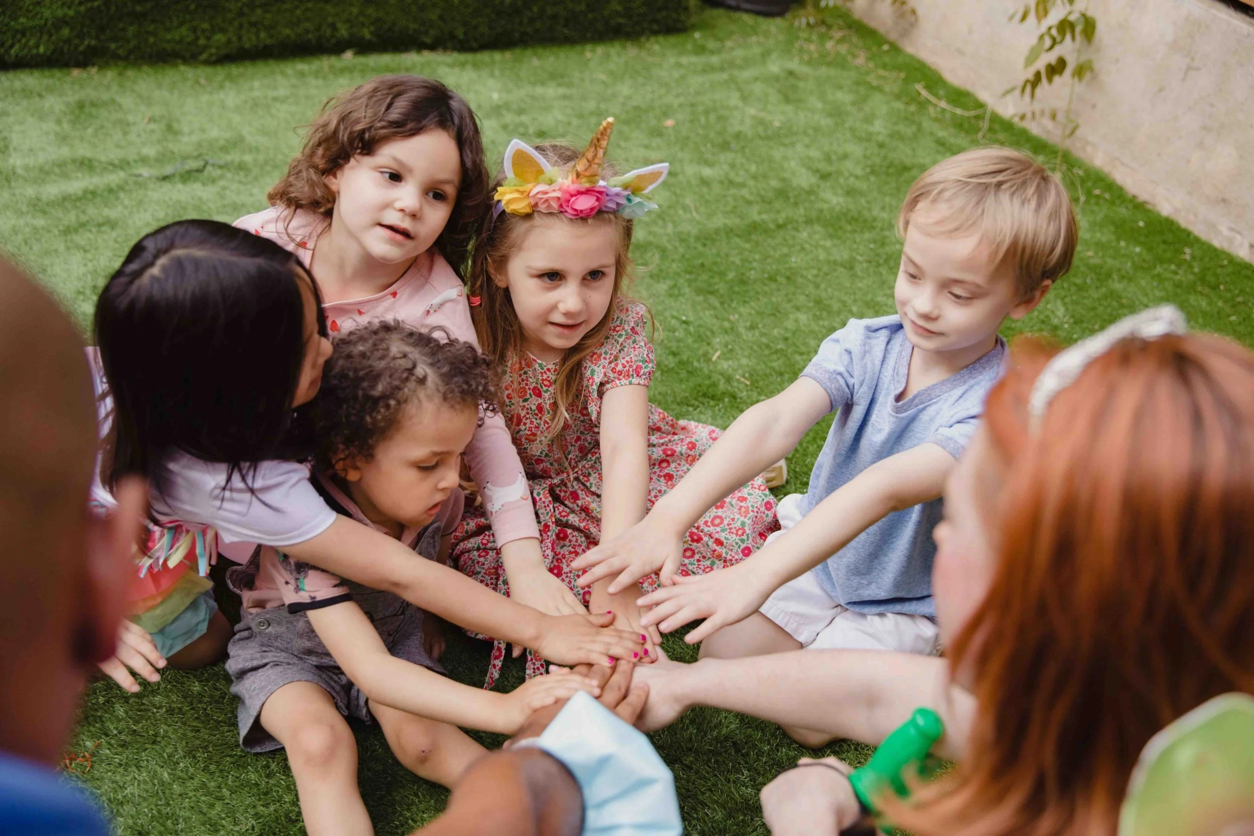 school children huddled in a circle