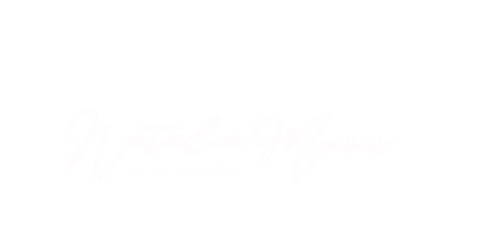 A black storefront sign with the words "Vegetala Marche" written in white cursive lettering.