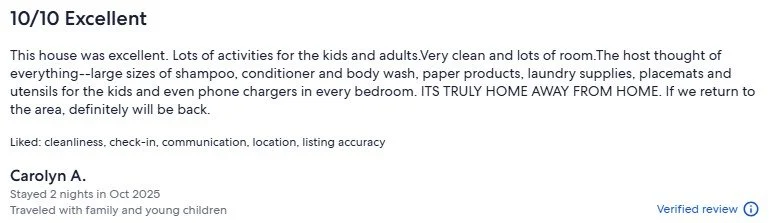 A review highlighting a clean, well-equipped house with activities for children and adults, describing it as a perfect getaway, with amenities like shampoo, conditioner, body wash, laundry supplies, and phone chargers, emphasizing cleanliness, communication, and accuracy.