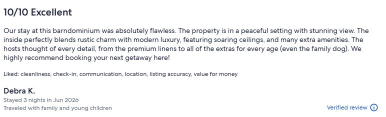 Review praising a stay at a rustic, luxurious Airbnb with modern amenities, spacious interiors, and beautiful views, highlighting cleanliness, communication, location, and value.