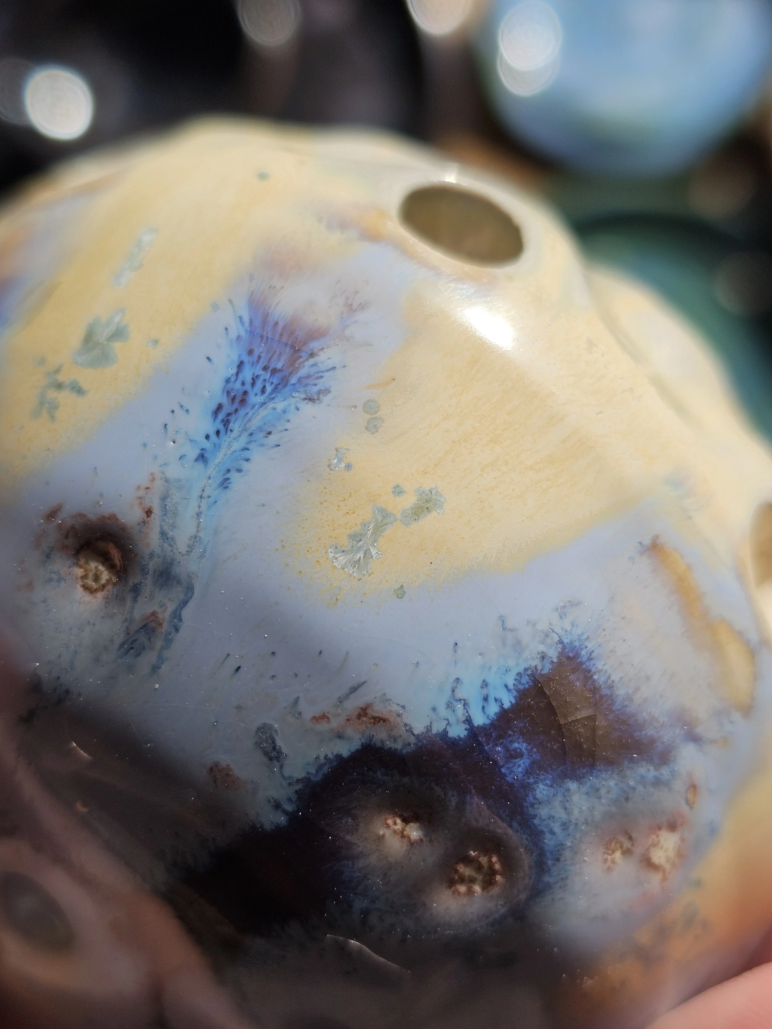 Close-up image of the inside of a pipe or metal container with discoloration and rust patches.
