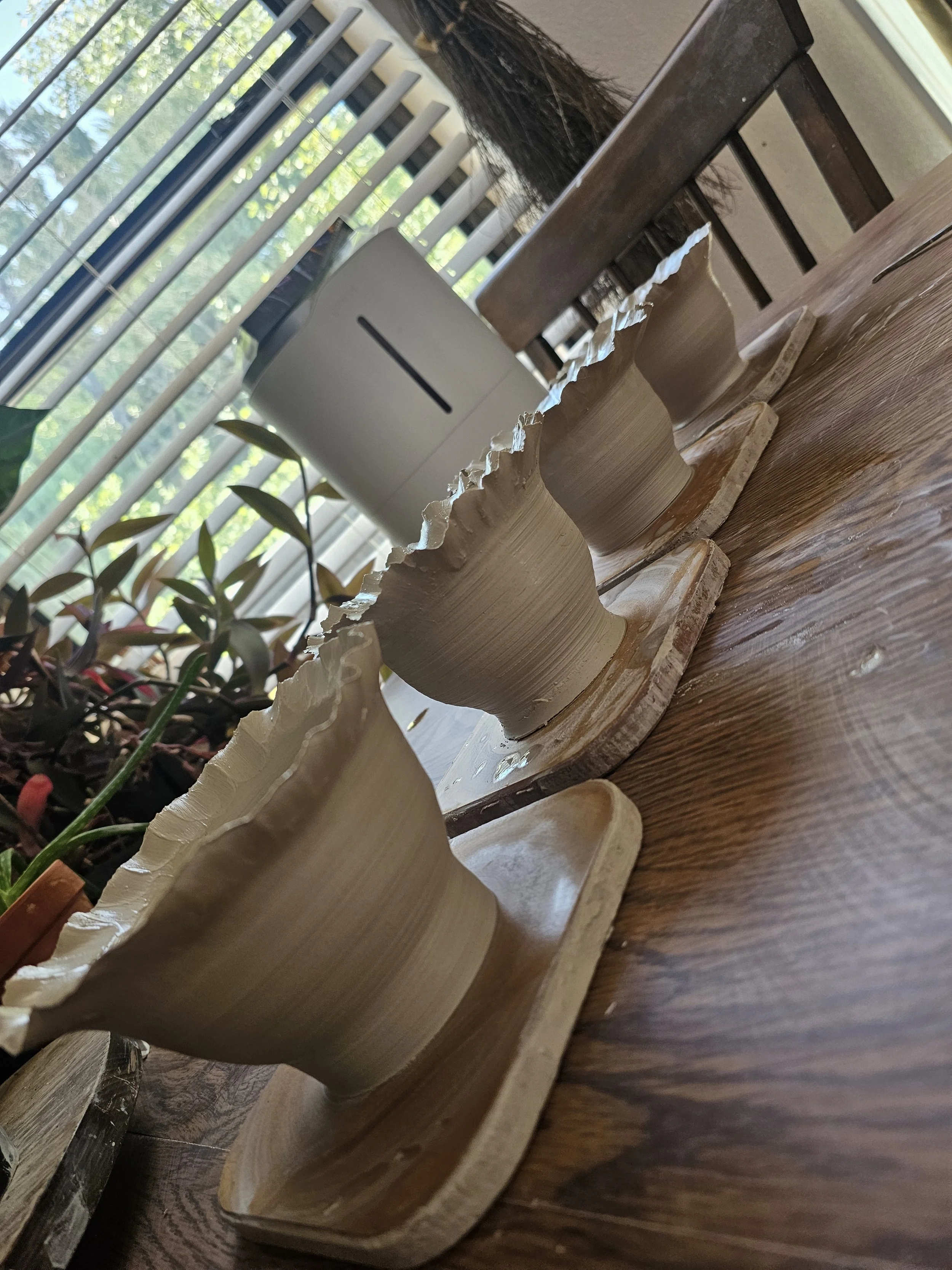 Close-up of decorative wheel-thrown ceramics pieces. 