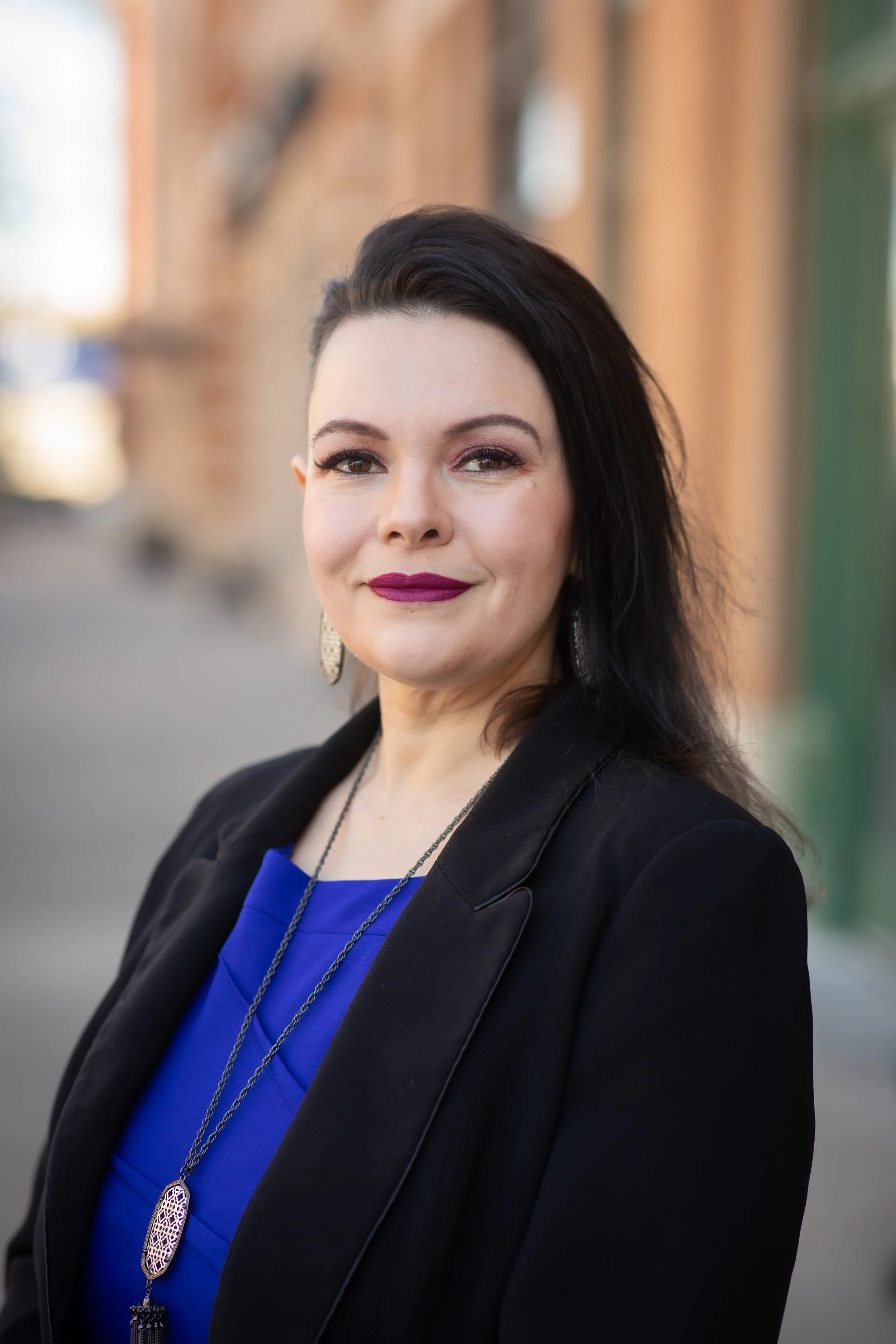 Rebecca Wilson, founder of Arkstone Career Strategy and ICF-certified executive coach for teens and young adults, wearing a professional blue top and black blazer.