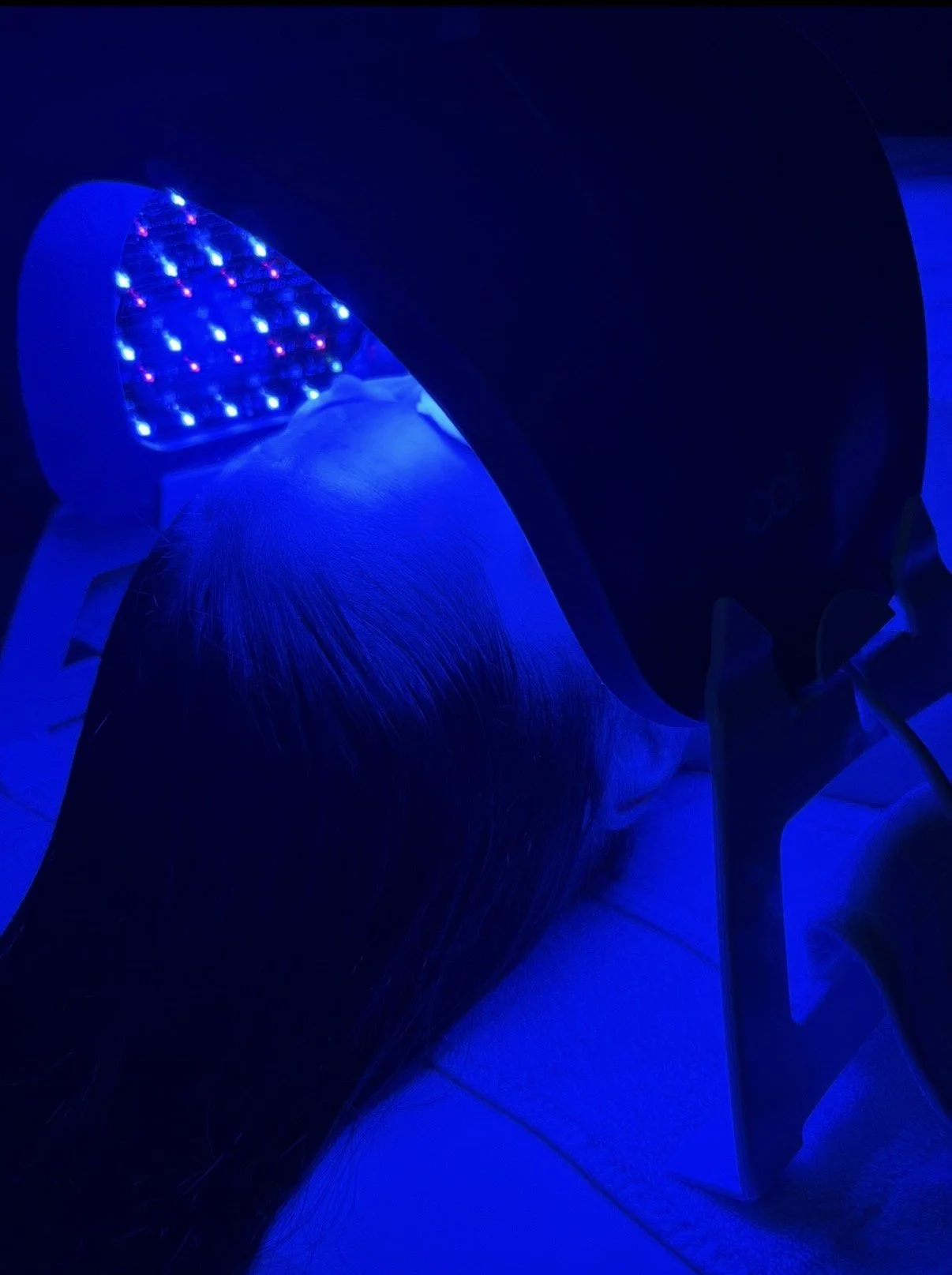 LED light therapy during a facial treatment at Luxe Beauty Aesthetics