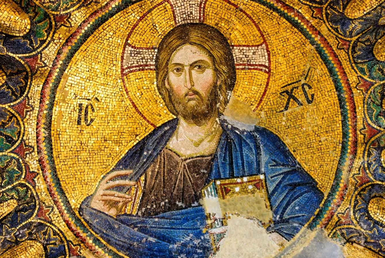 "Byzantine mosaic of Christ Pantocrator in gold, holding a book"