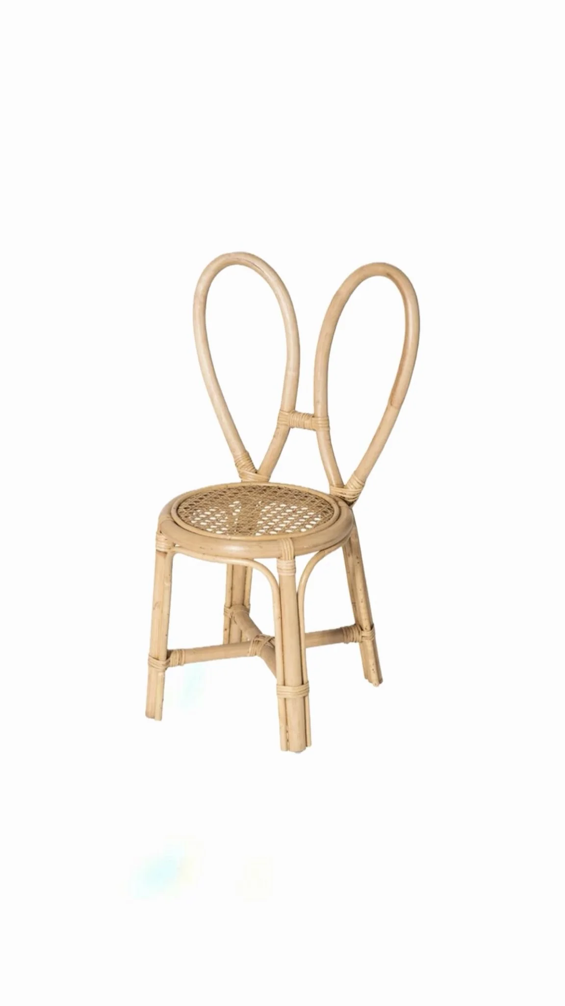A wicker chair with a rounded back and a woven seat, set against a white background.