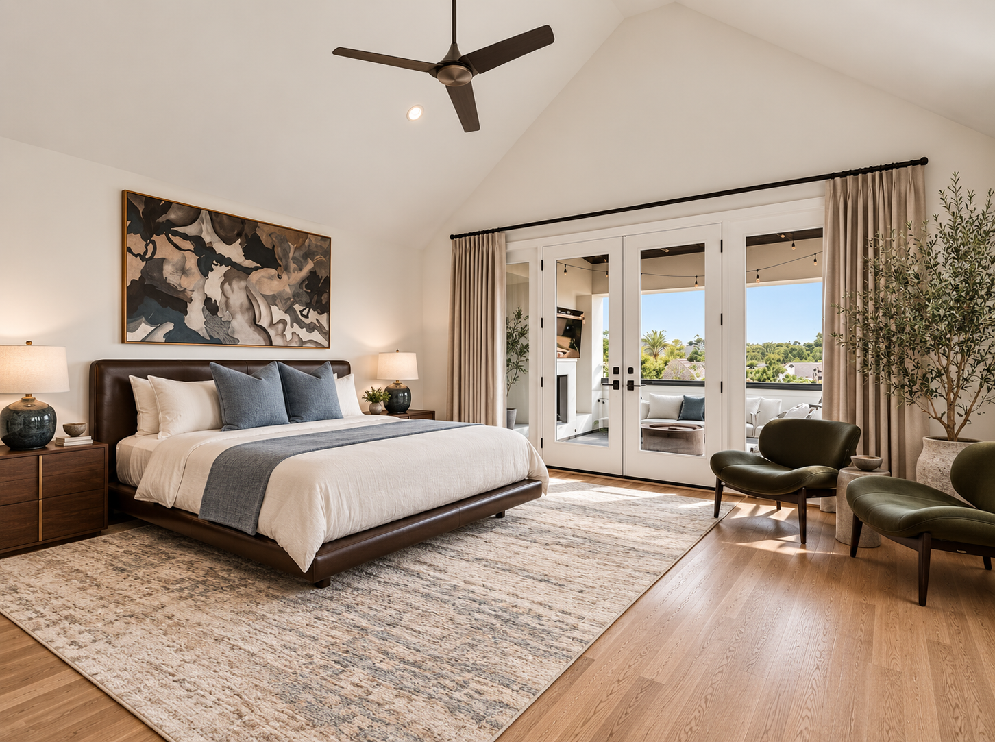 Contemporary bedroom with blue bedding accents, oversized artwork and an adjoining outdoor terrace
