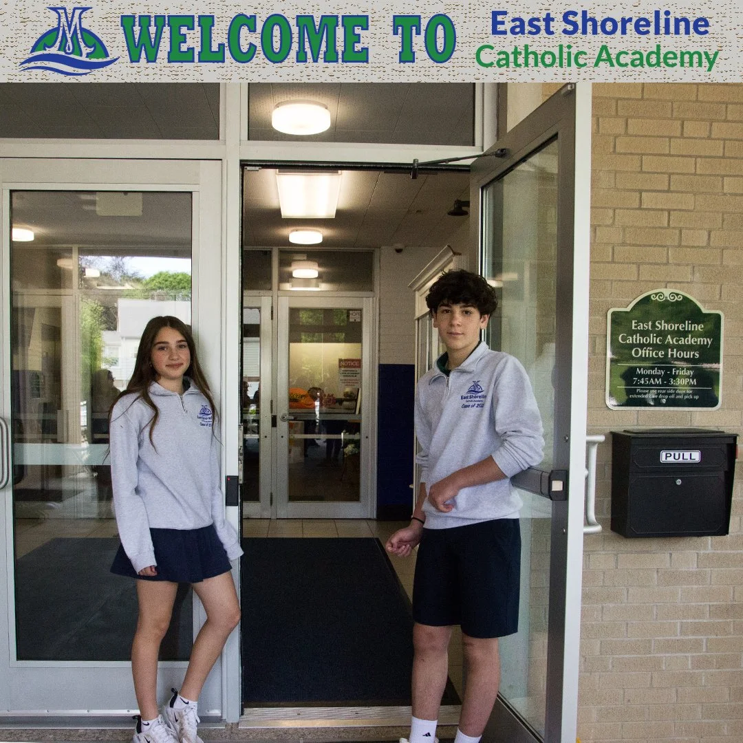 Students standing at the entrance of East Shoreline Catholic Academy, with a welcome sign above and a sign displaying office hours beside the door.