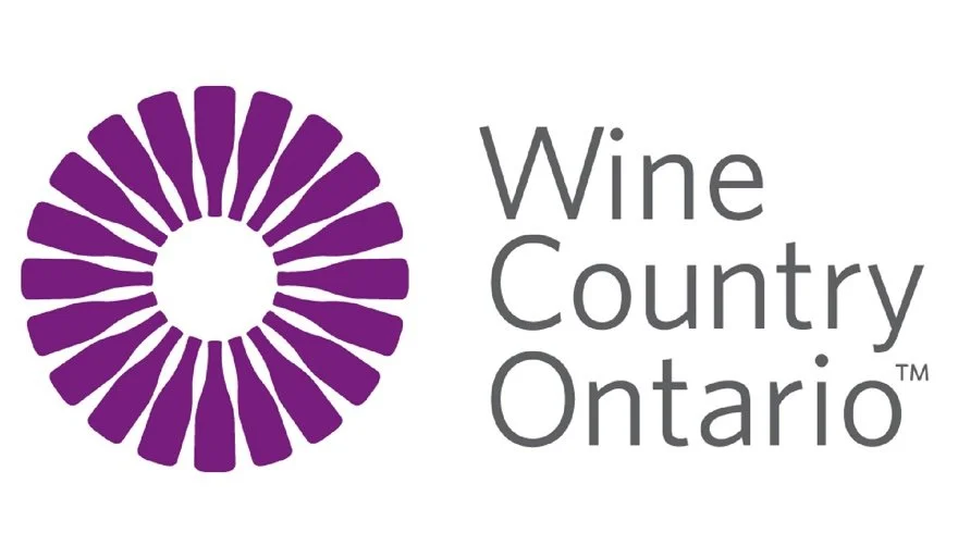 Logo of Wine Country Ontario featuring a purple stylized circular design and the text 'Wine Country Ontario'.