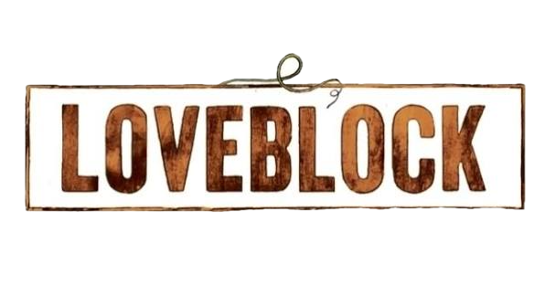 A white sign with the word "LOVEBLOCK" in large brown letters on it, hanging from a metal ring.