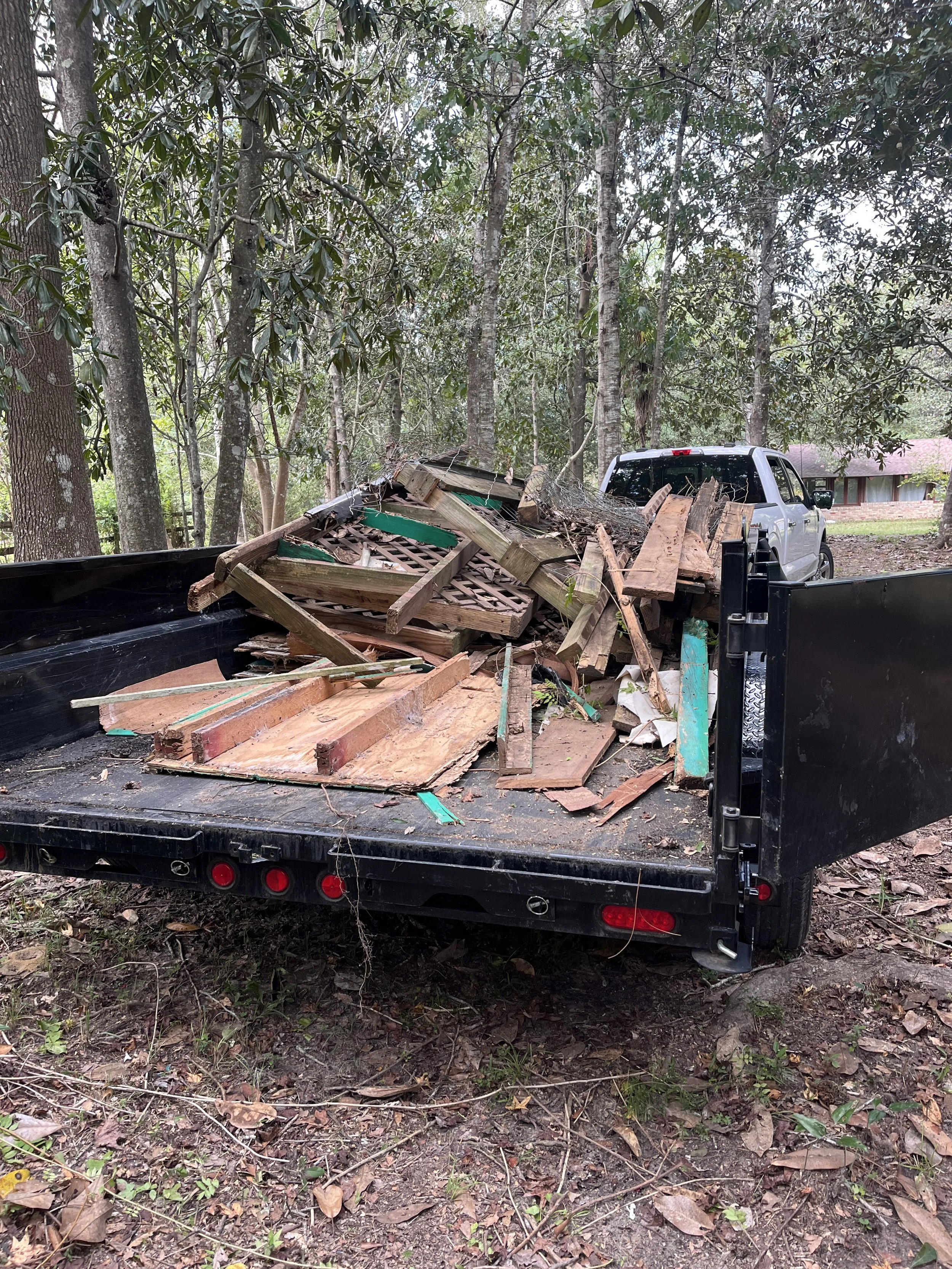 Dumpster half full of wood in gulfport Ms